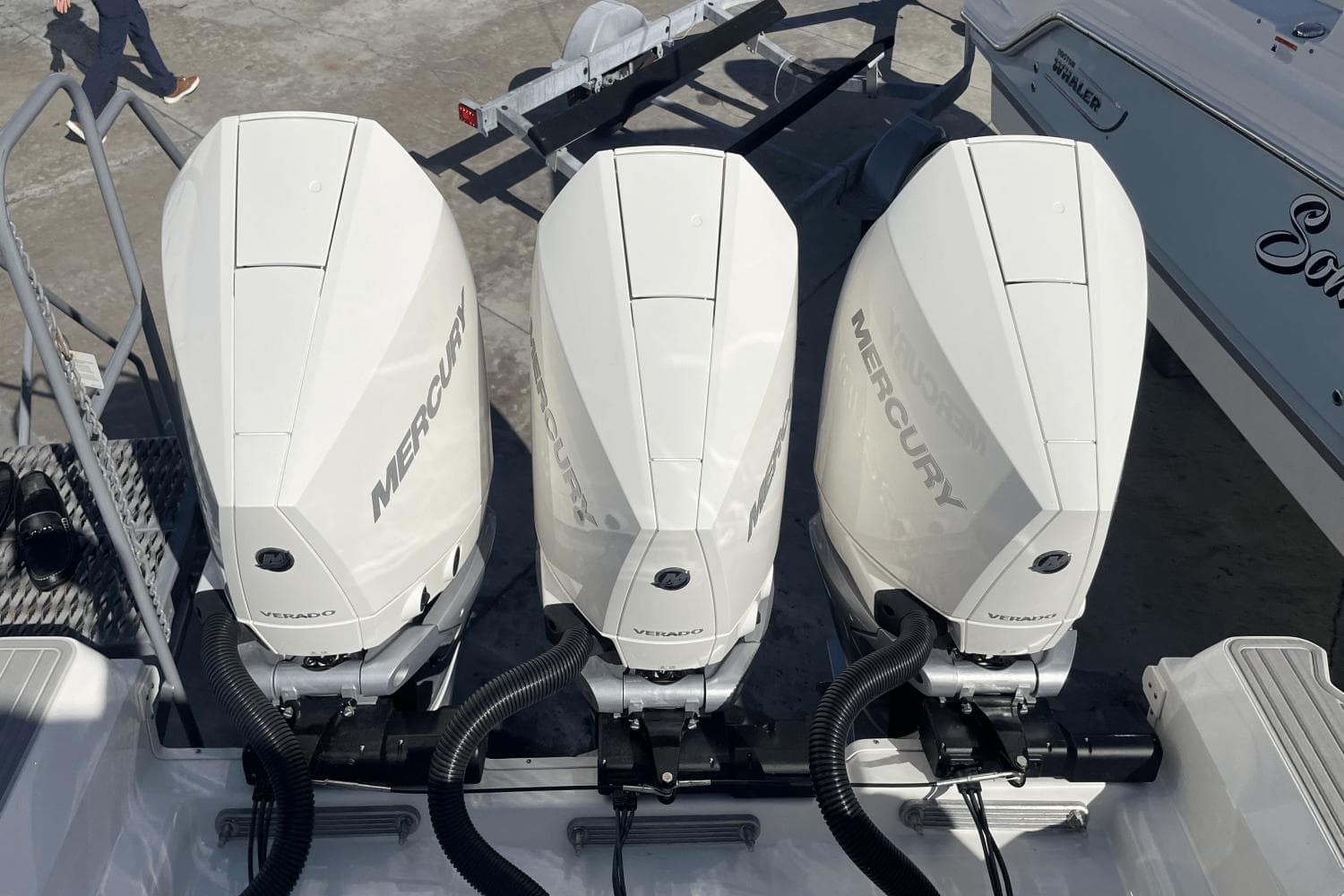 2024 Sea Ray Sundancer 320 Outboard with triple Mercury Verado engines, docked at marina.
