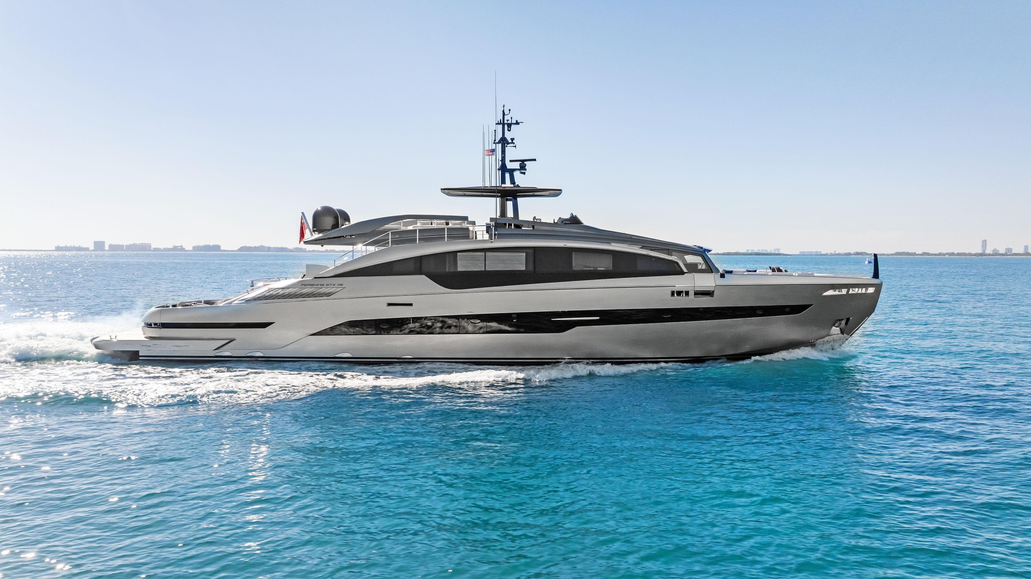 2023 Pershing GTX 116 yacht cruising on clear blue ocean waters.