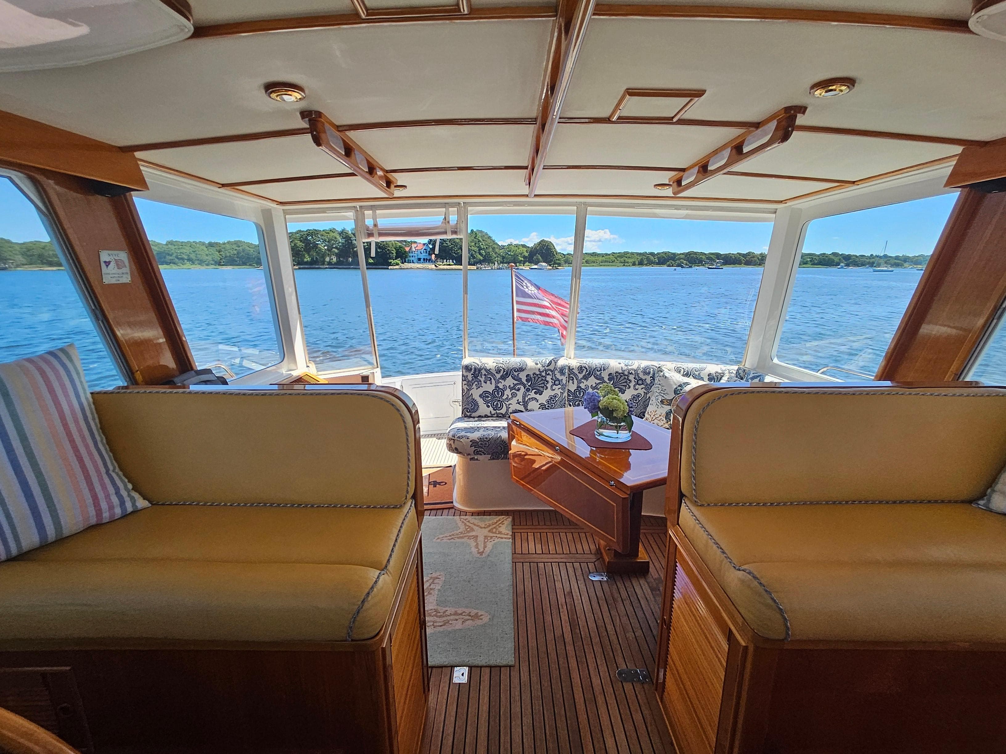 Interior of 2002 Grand Banks 49 Eastbay HX yacht with scenic water view.
