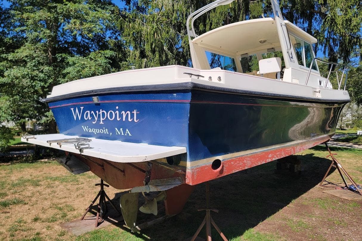 1997 Albin 28 Tournament Express boat named "Waypoint" in Waquoit, MA, on stands.