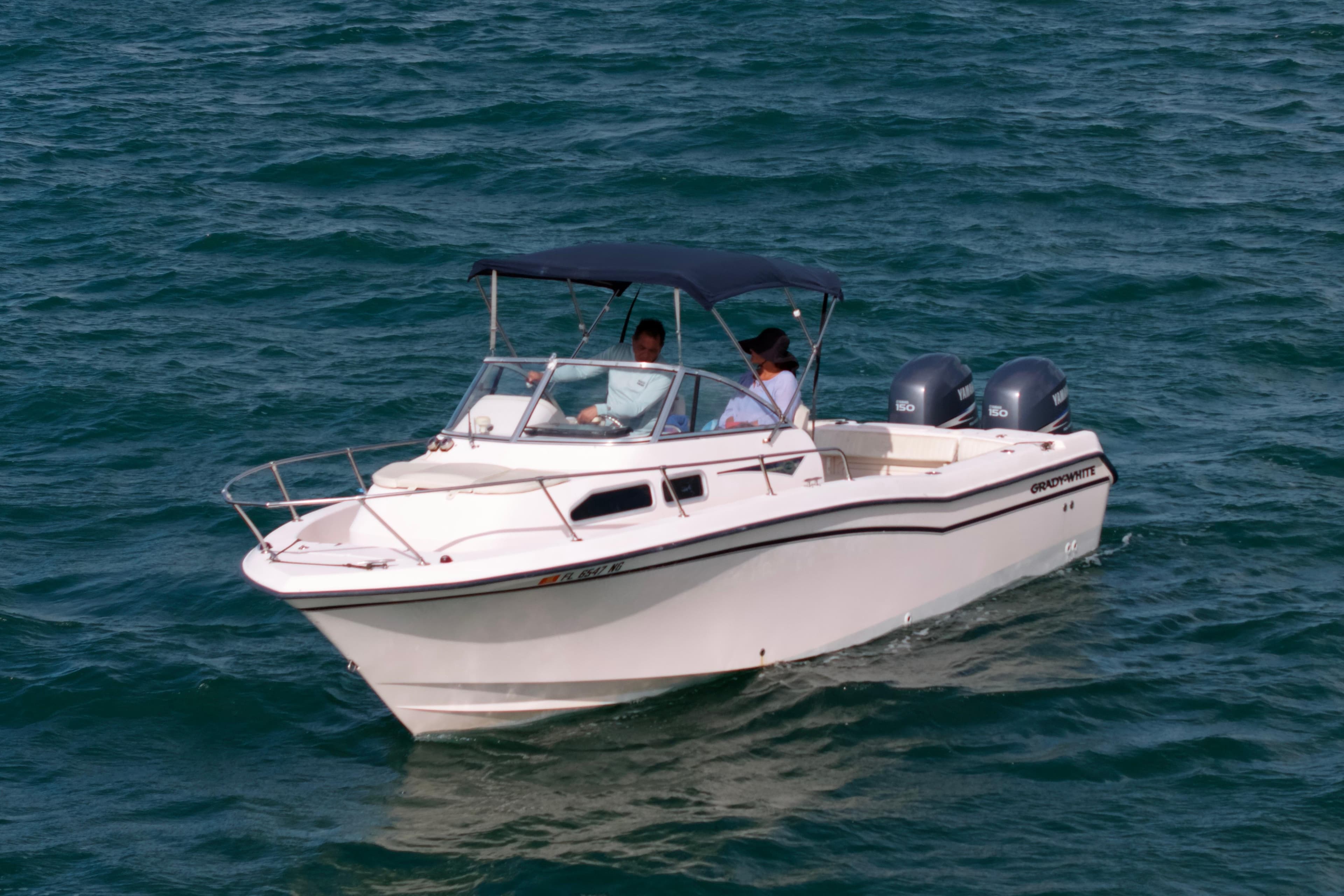 2005 Grady-White Journey 258 boat cruising on open water.
