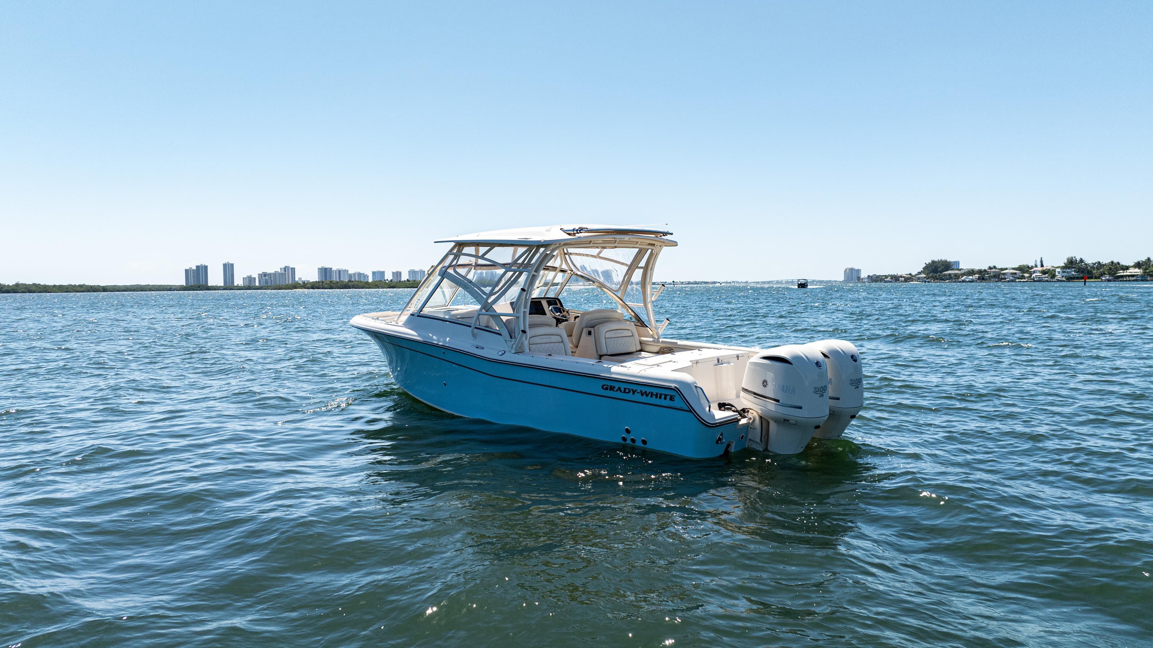 2020 Grady-White Freedom 285 boat on open water, clear sky background.