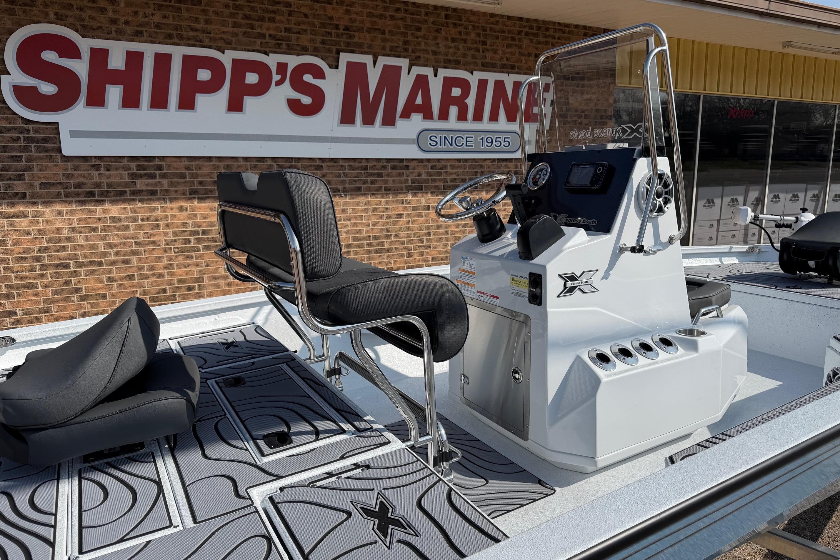 2026 Xpress H20B Bay boat at Shipp's Marine dealership, featuring sleek design and modern controls.