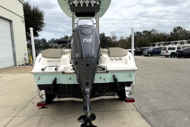 2024 Key West 203 FS boat with Yamaha 150 engine, parked outdoors.