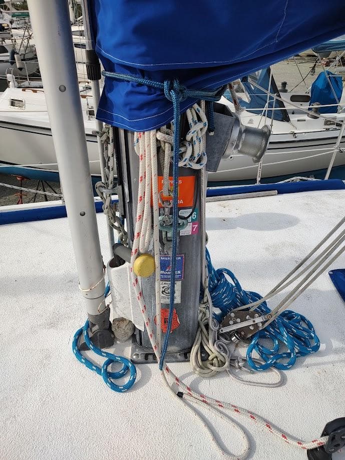 Mast base of 1981 Bruce Roberts 450 sailboat with ropes and winch.