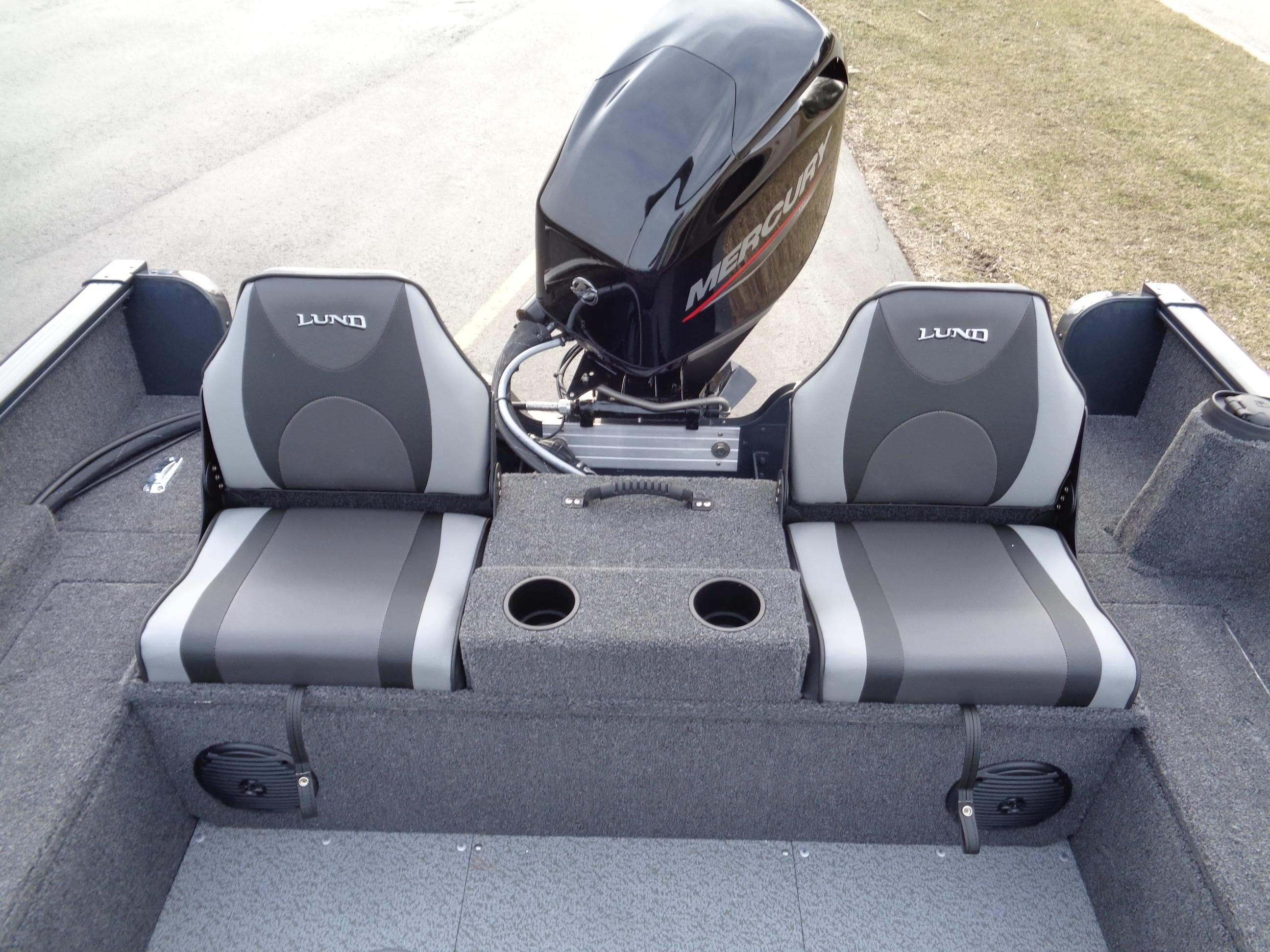 2024 Lund 1650 Rebel XL Sport boat interior with dual seats and Mercury outboard motor.