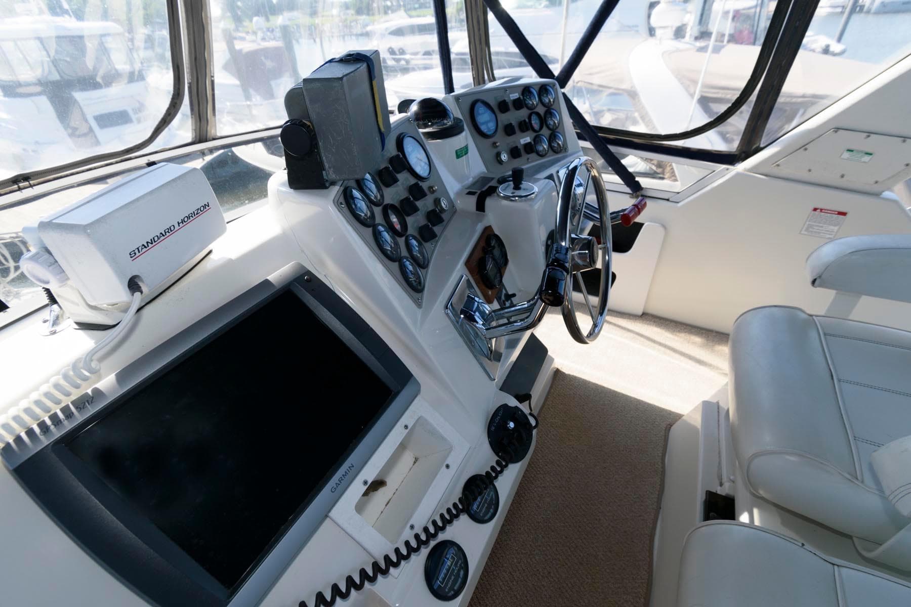 Interior view of 1997 Carver 400 Cockpit Motor Yacht helm.