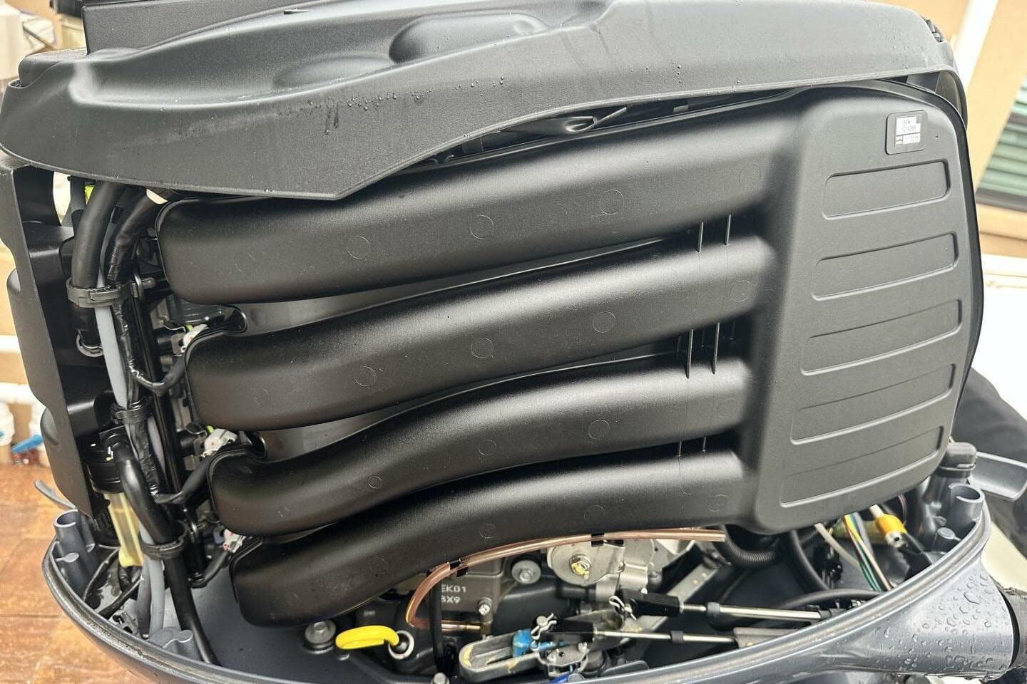 Close-up of a 2020 NauticStar 2140 Sport Shallow Bay boat engine components.