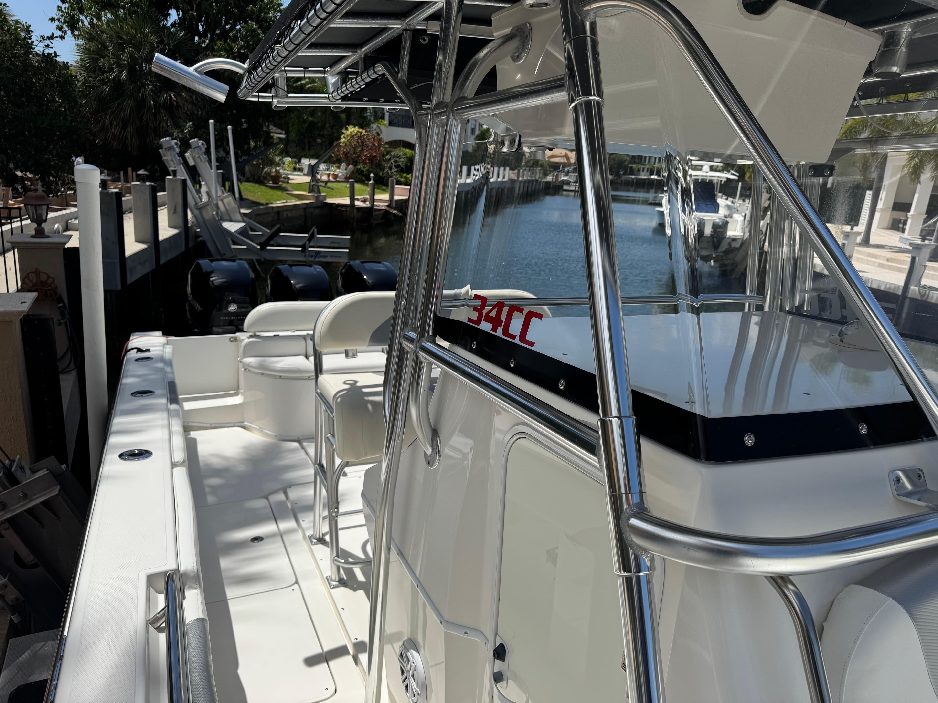 2008 Fountain 34 Center Console boat docked, featuring sleek design and spacious deck.