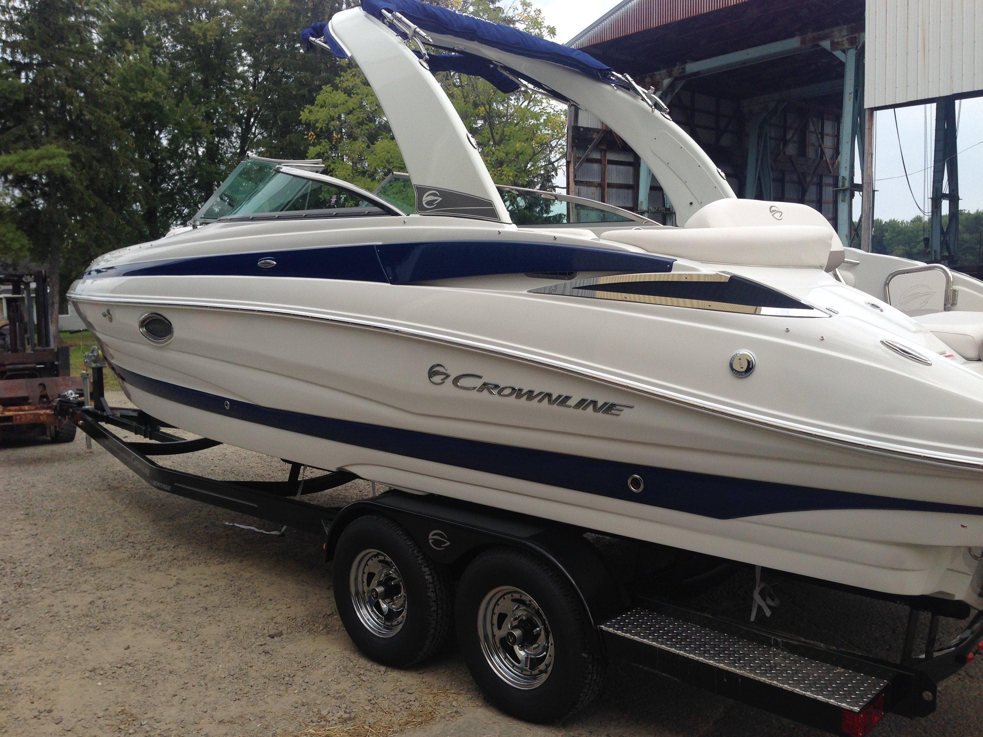 2016 Crownline 285 SS boat on trailer, side view.
