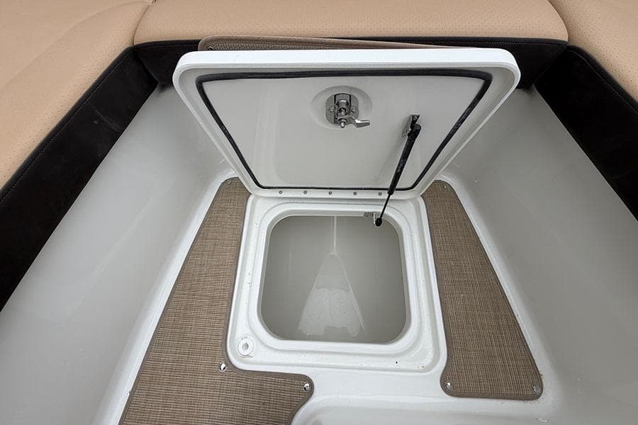Open storage compartment on 2026 Sea Ray SDX 270 Outboard boat.