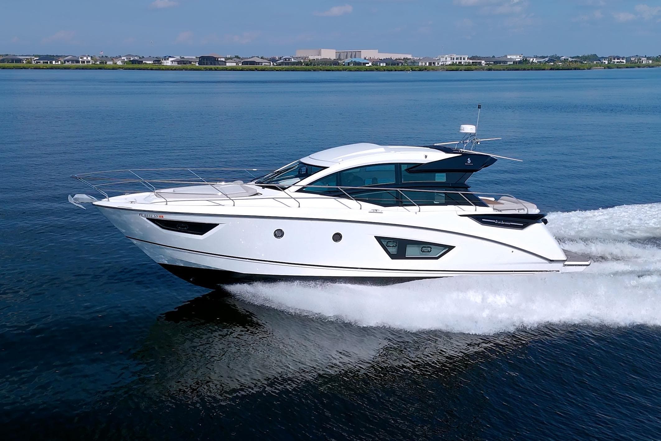 2019 Beneteau Gran Turismo 50 yacht cruising on calm blue waters.