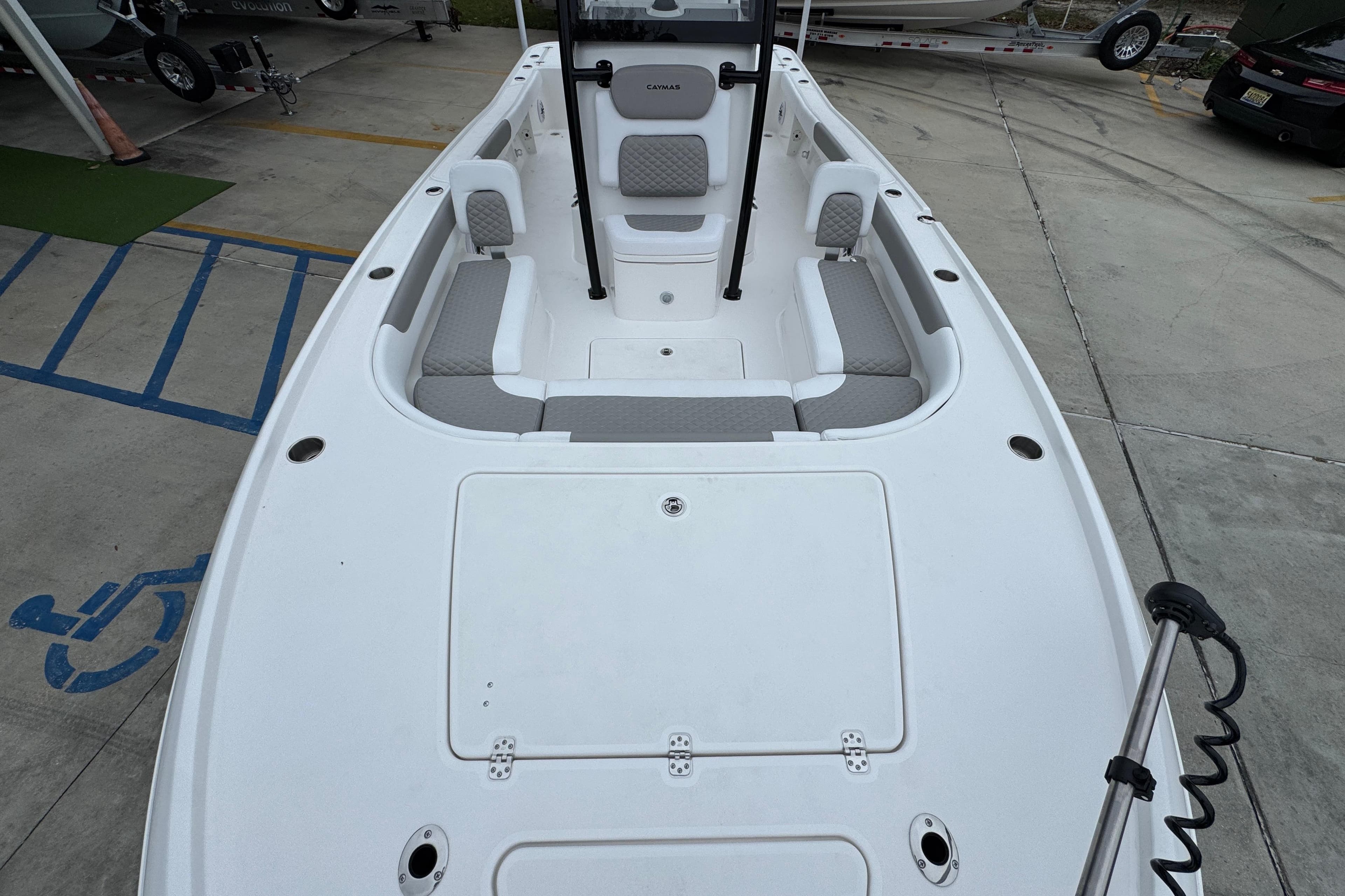 2026 Caymas 26 HB boat interior with seating and storage compartments.