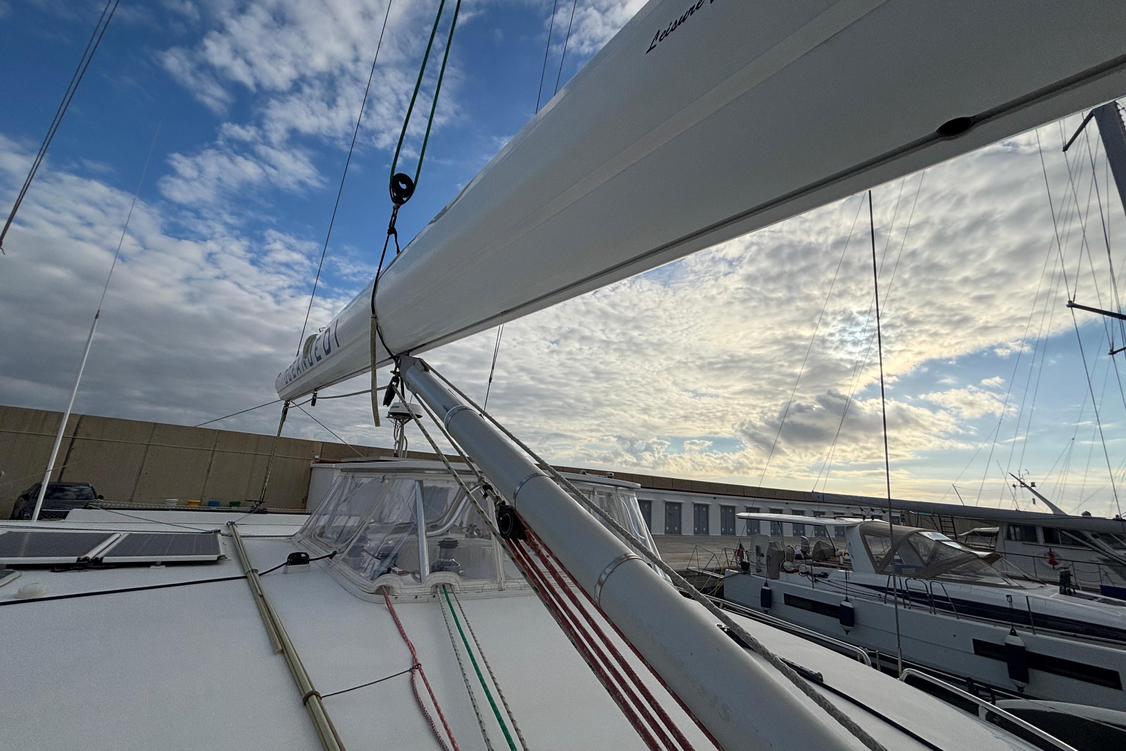 Sailing yacht Kelsall 58 KSS (2009) docked under a partly cloudy sky.