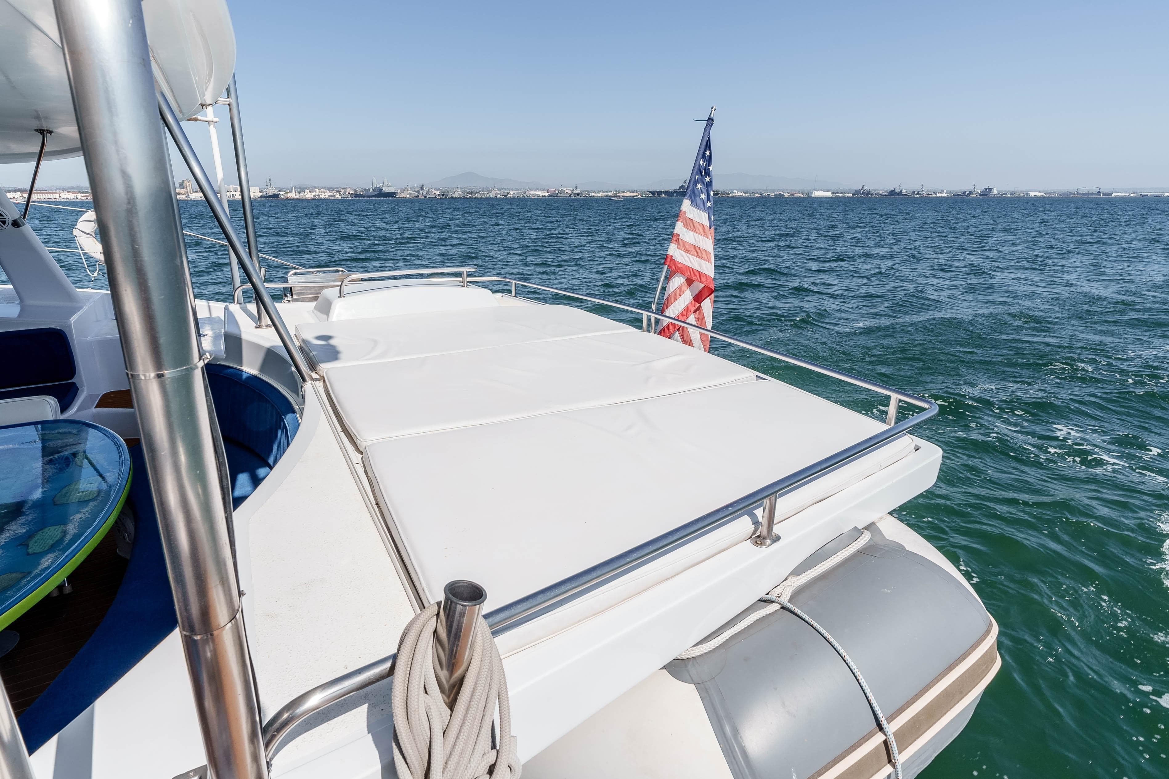 2009 Kelsall KSS 58 yacht deck with American flag on open sea.