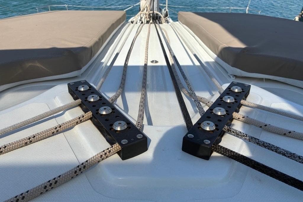 Deck view of 2024 Lagoon 51 catamaran with rigging and seating.