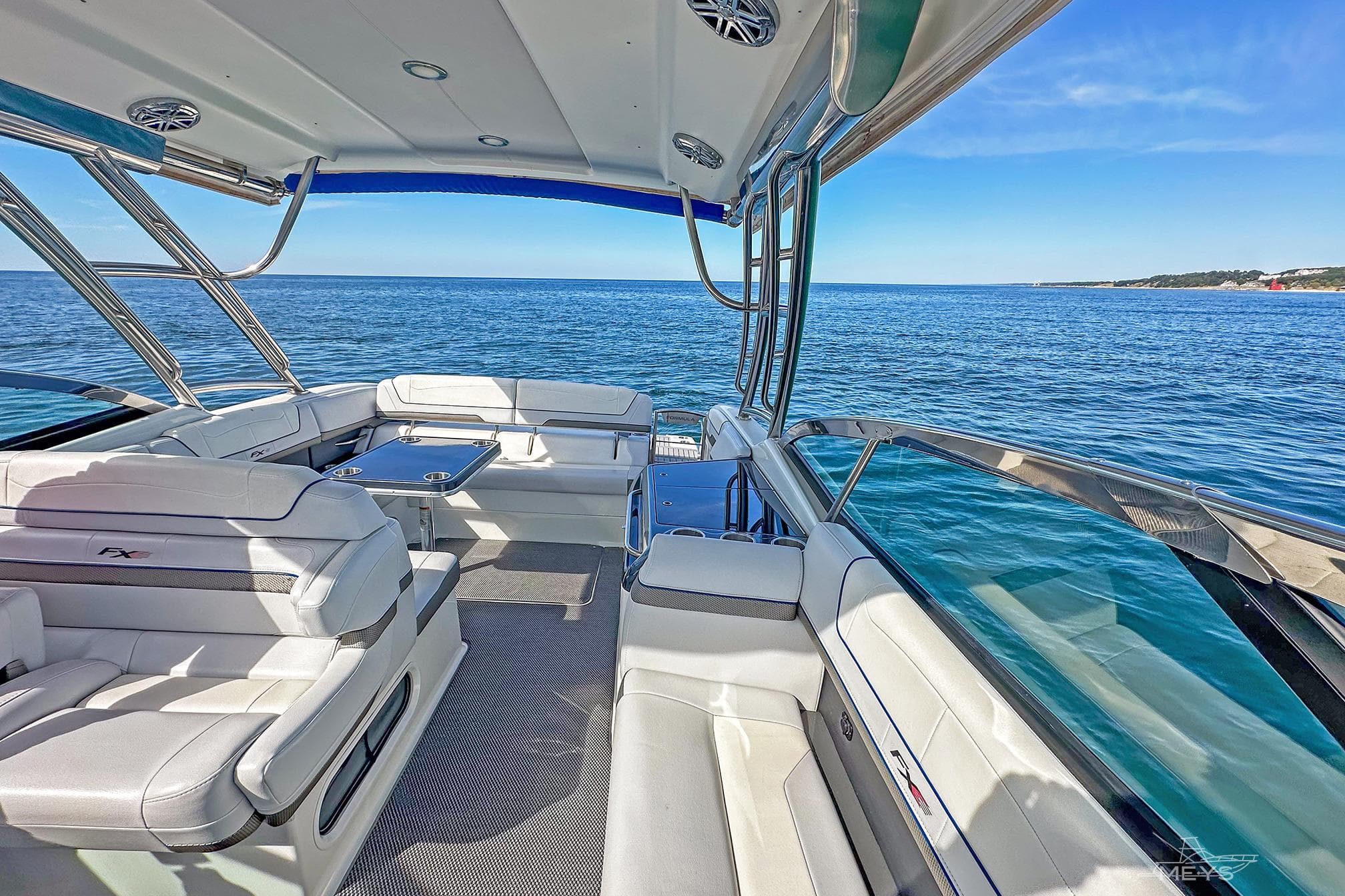 2018 Formula 350 FX Crossover Bowrider on open water, featuring luxurious seating and sleek design.