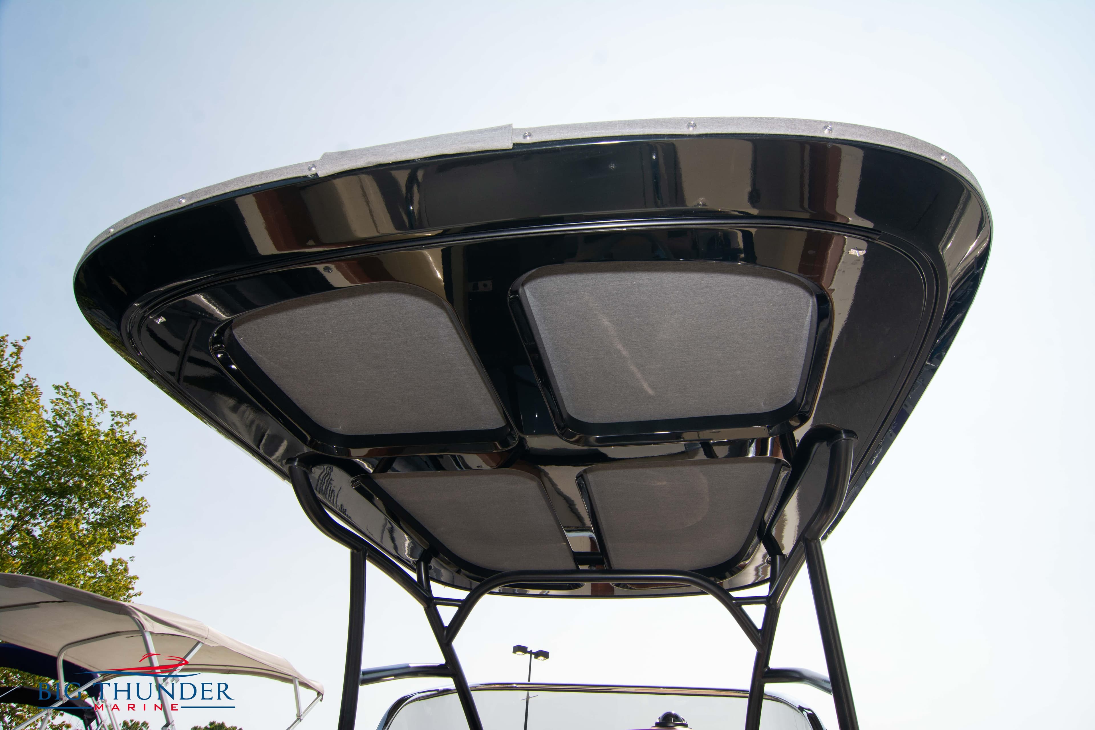 2024 Capoforte FX270 boat canopy, sleek design, viewed from below against clear sky.