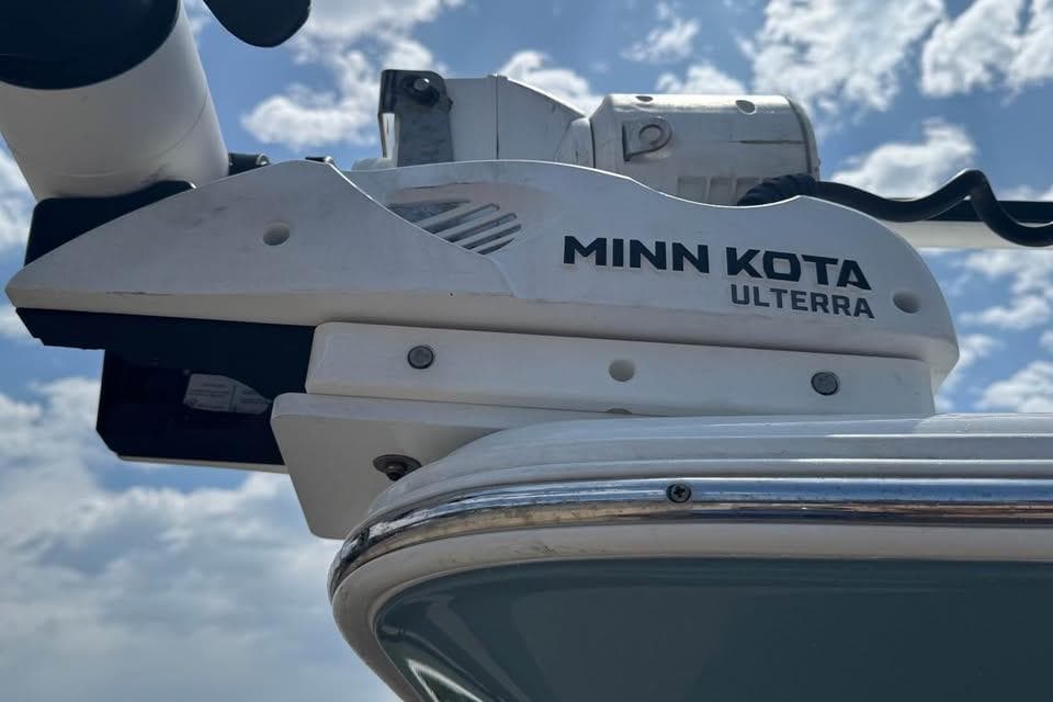 Minn Kota Ulterra motor on 2023 Sea Hunt Ultra 239 SE boat under cloudy sky.