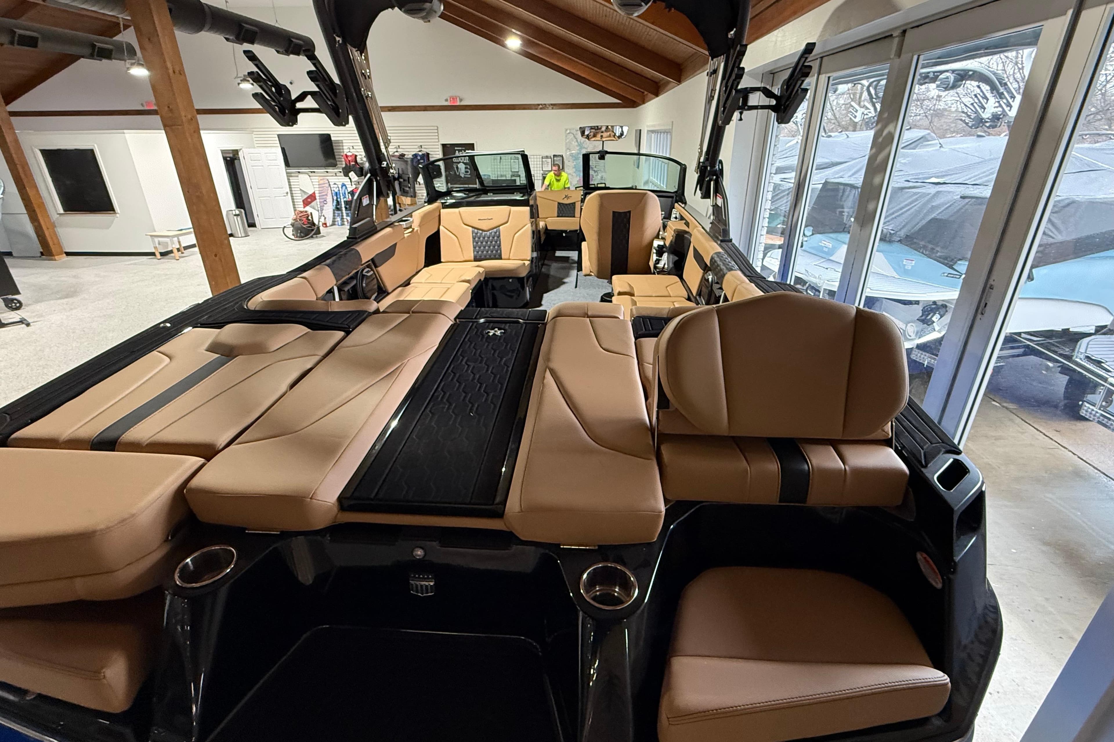 2026 MasterCraft XT24 boat interior with luxurious tan seating and modern design.