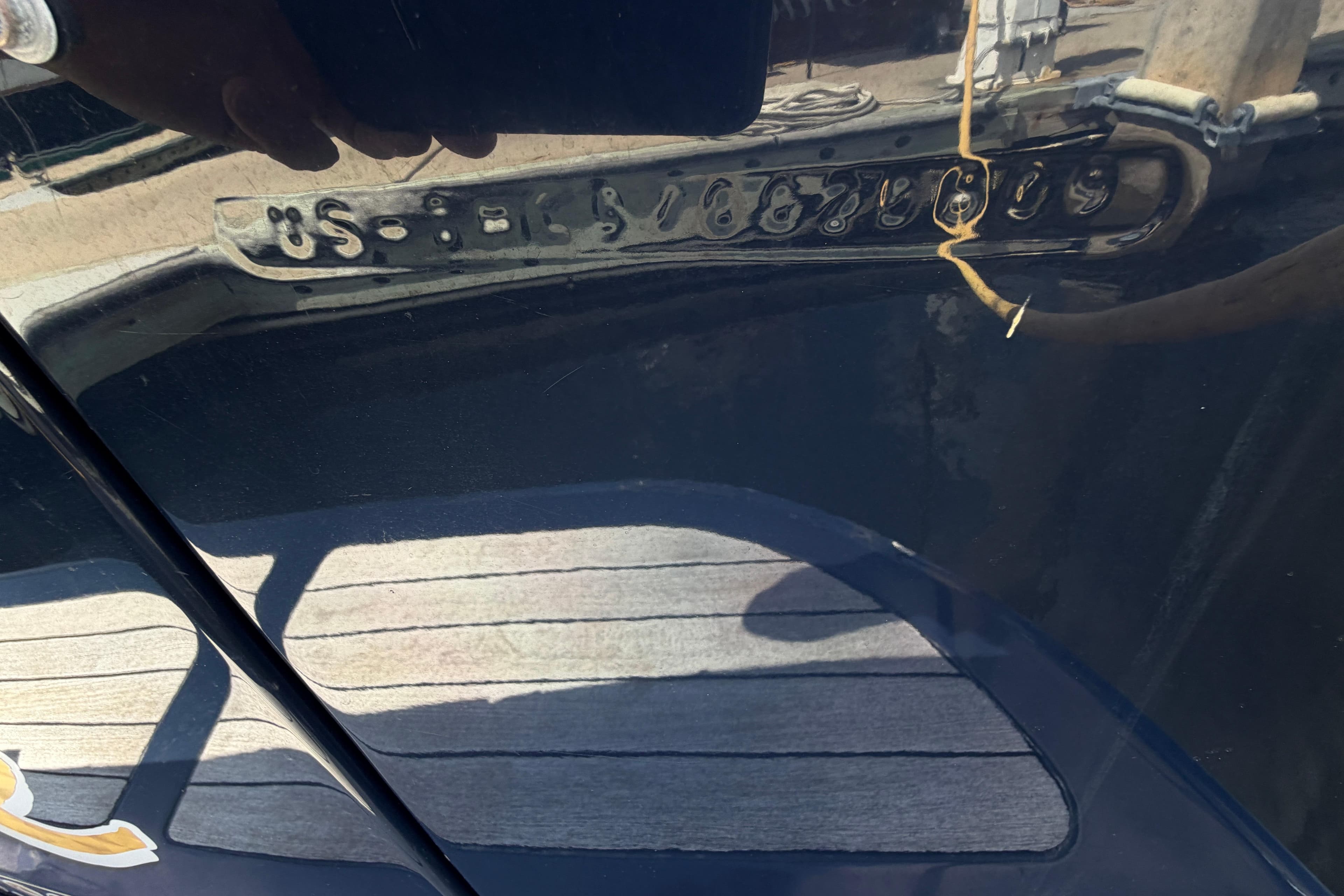 Close-up of a 2009 Hinckley Picnic Boat 37 MKIII hull identification number.
