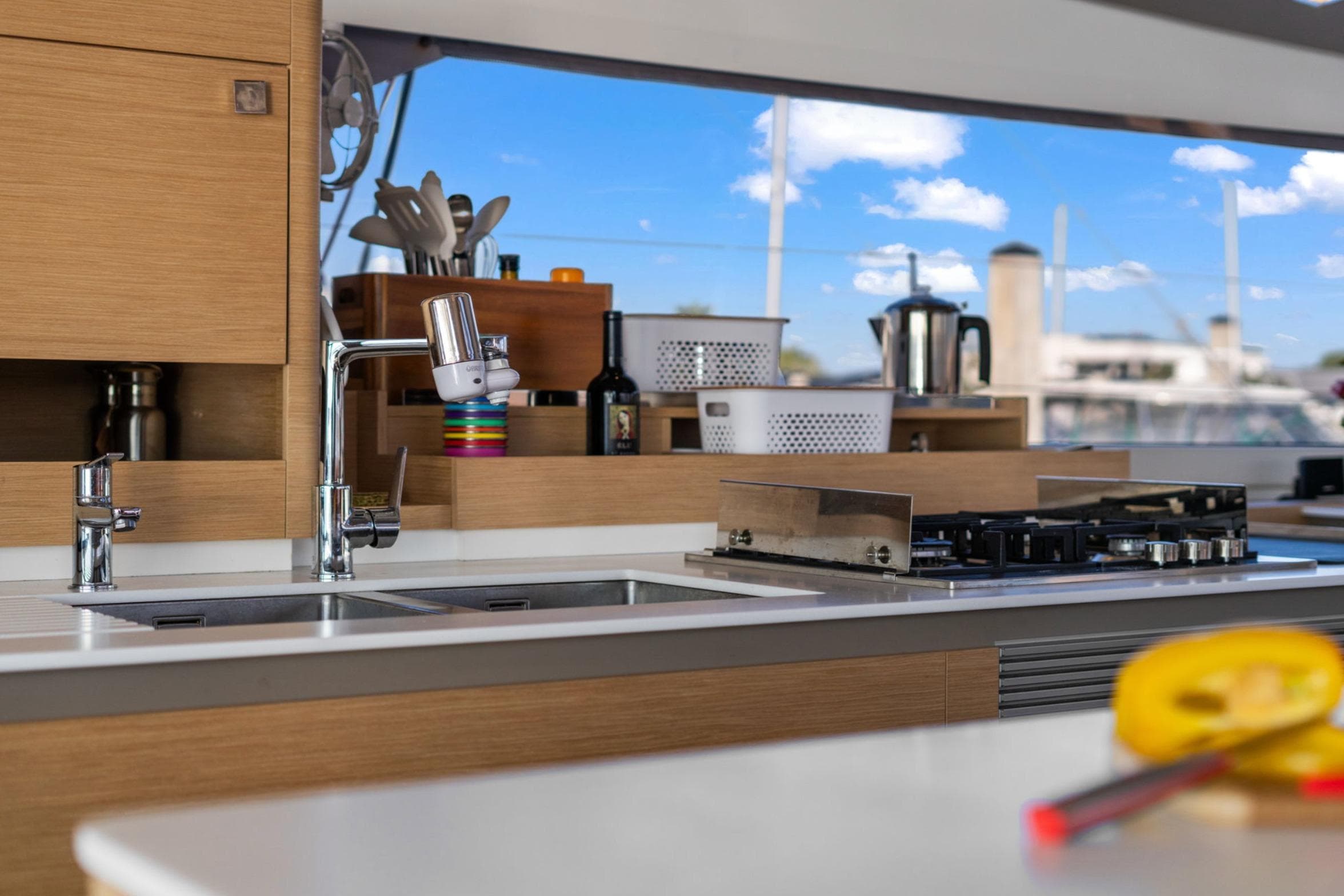 Modern kitchen interior of 2024 Fountaine Pajot Aura 51 Catamaran with sleek design.