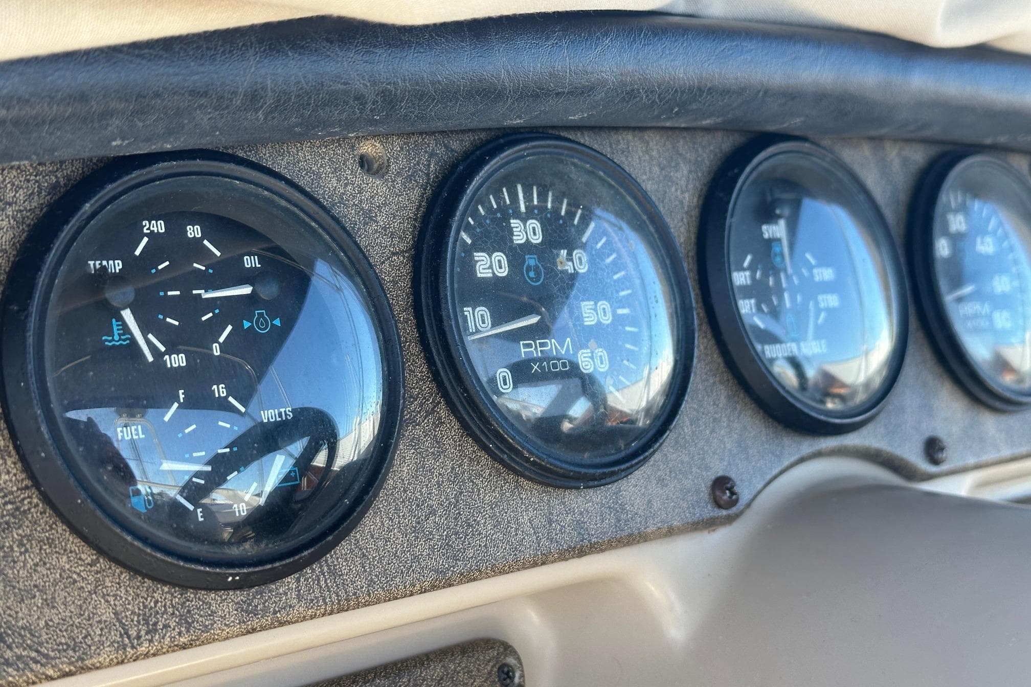 Dashboard gauges of a 2005 Carver 360 Sport Sedan, showing RPM and engine metrics.
