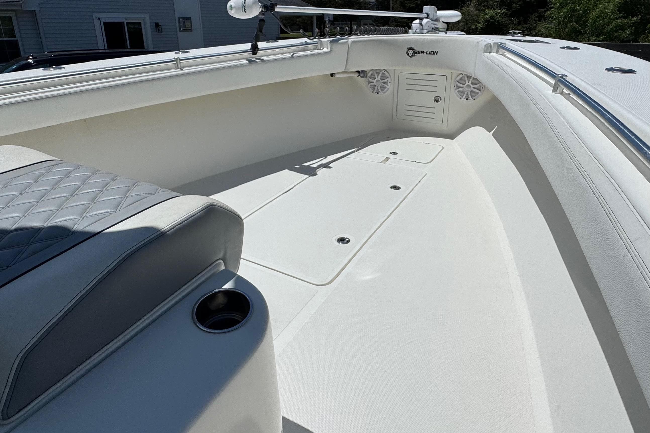 2020 Sea-Lion 34 TE boat interior with cushioned seating and storage compartments.