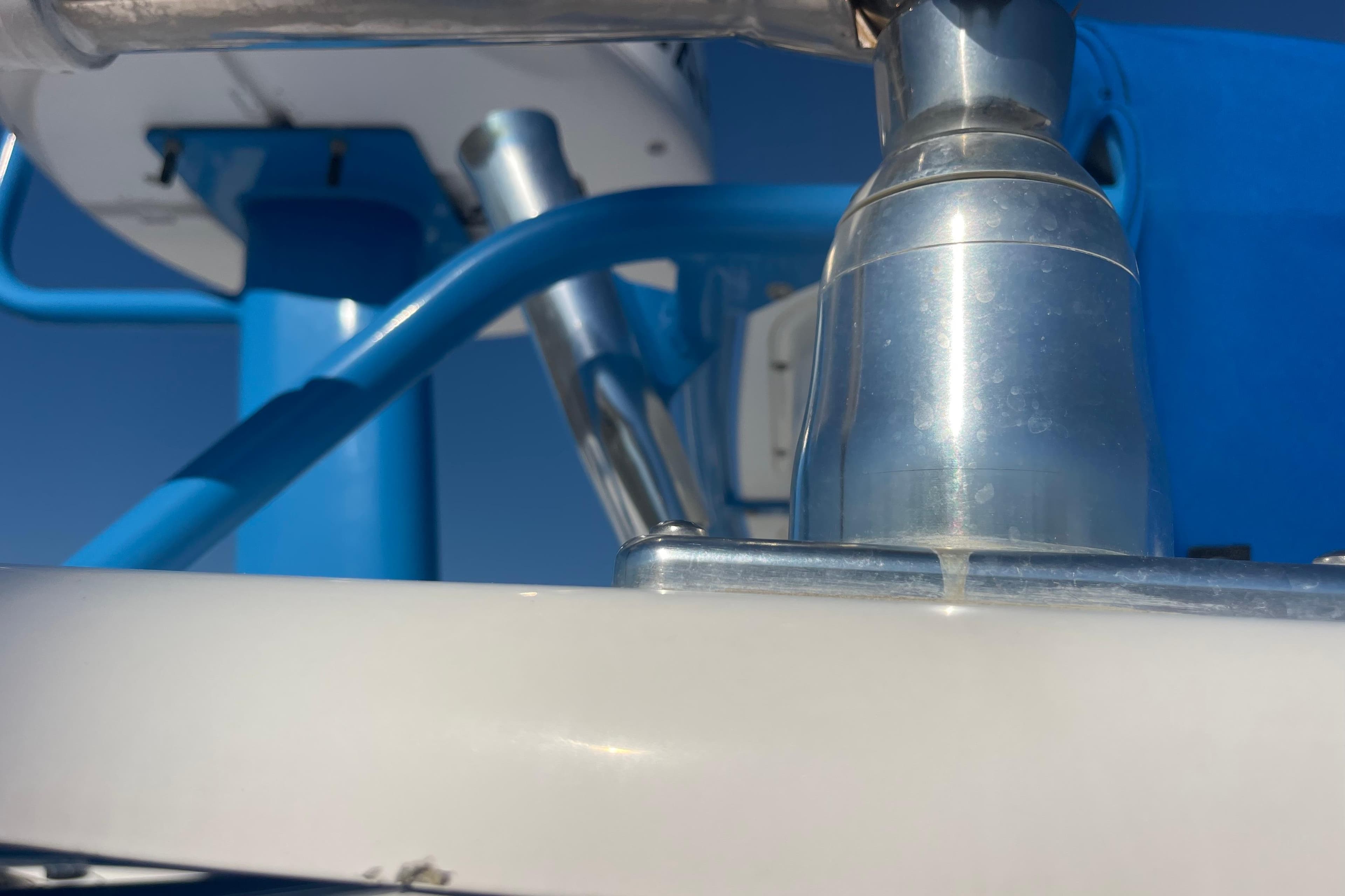 Close-up of 2021 Everglades 243 Center Console boat's metal and blue structural components.