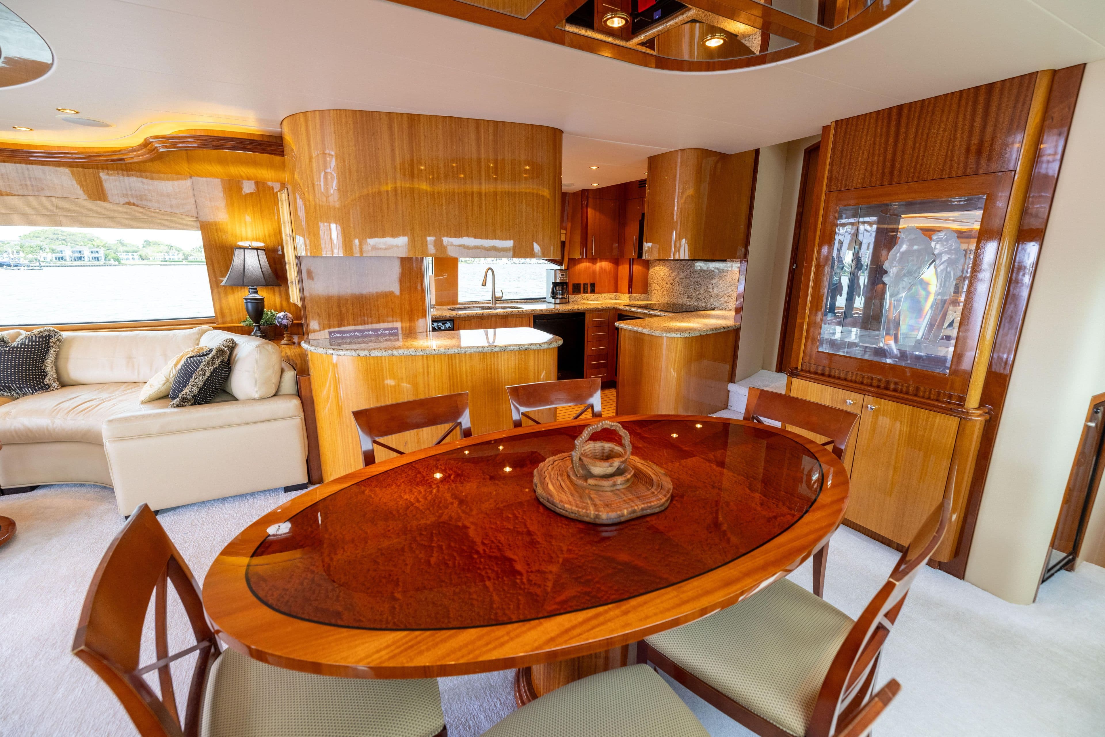 Luxurious interior of 2005 Hatteras 80 Motor Yacht with elegant wood finishes and modern furnishings.