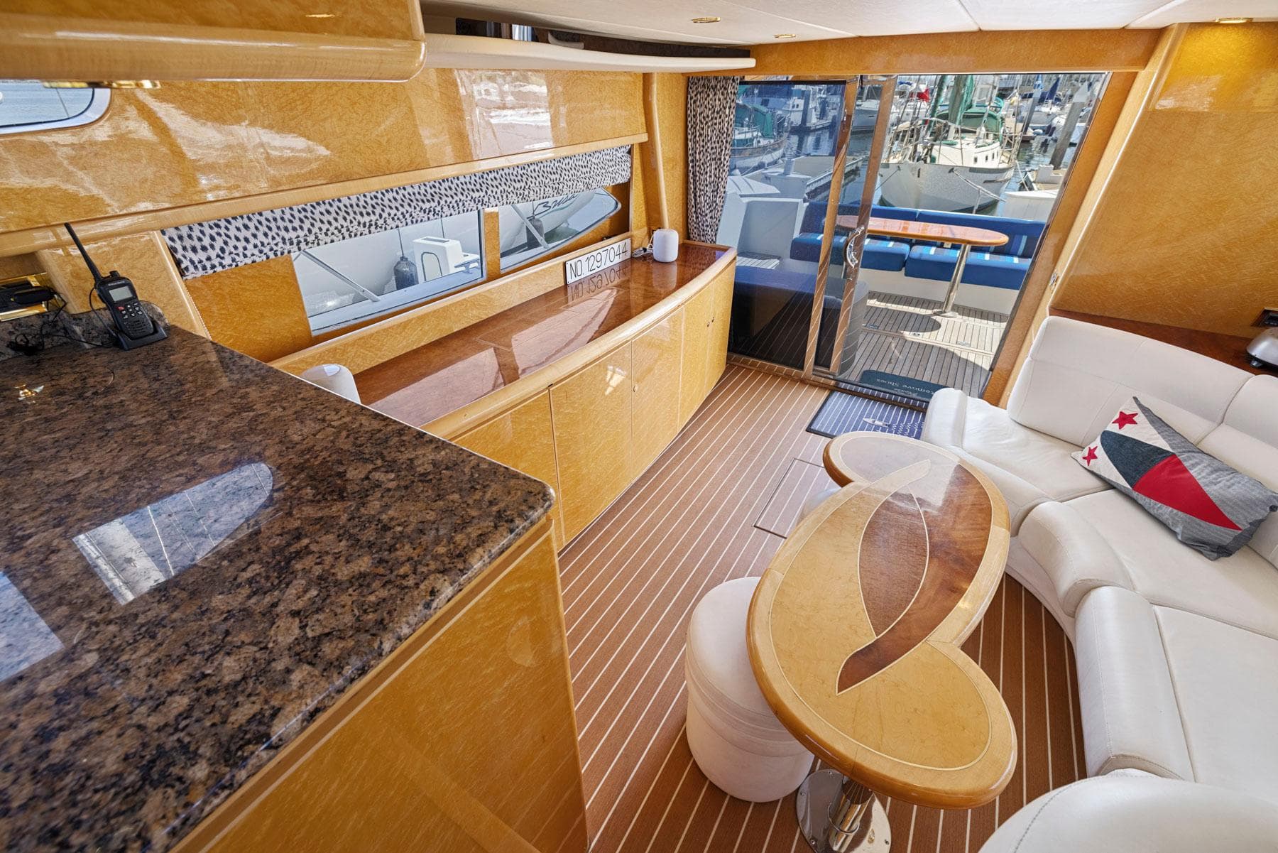 Luxurious interior of 2008 Dyna 51 yacht with elegant wood finishes and modern furnishings.