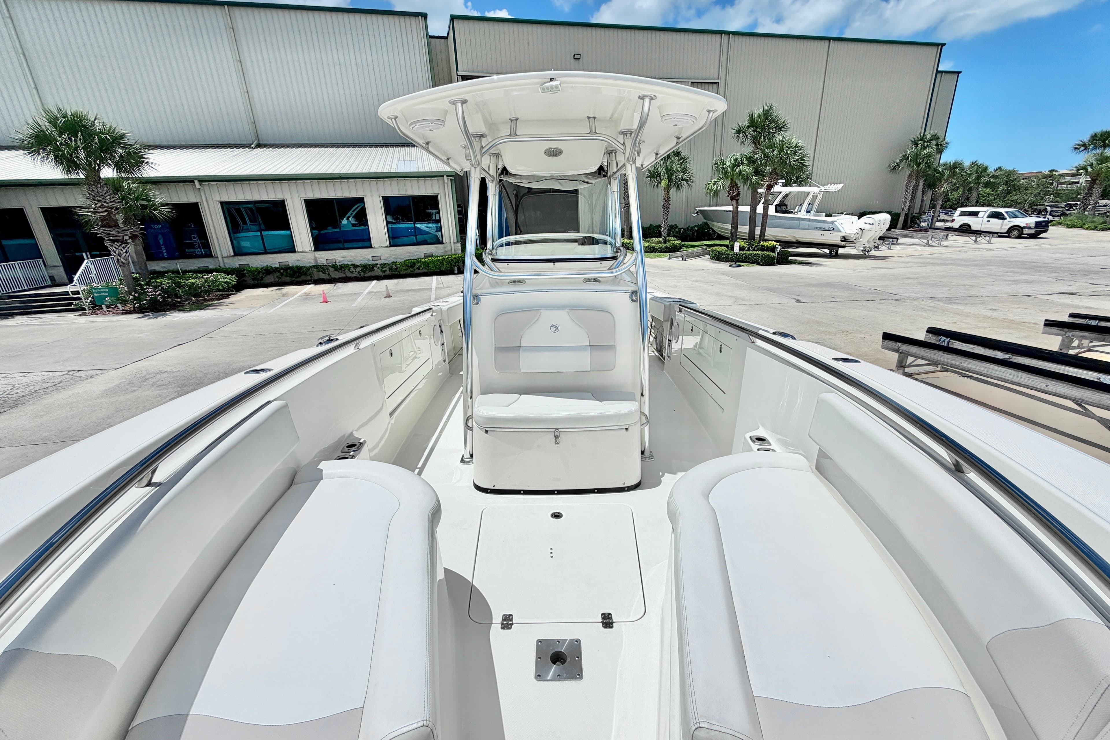 2013 Edgewater 318CC boat interior with seating, docked near a building.