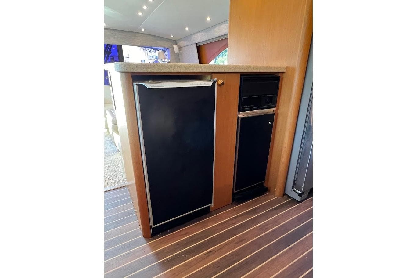 Interior of 2002 Ocean Yachts 56 Super Sport with compact kitchen appliances.