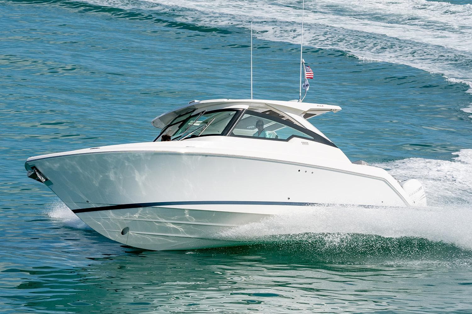 Manufacturer Provided Image: 2025 Tiara Yachts 34 LX cruising on open water, showcasing sleek design and performance.