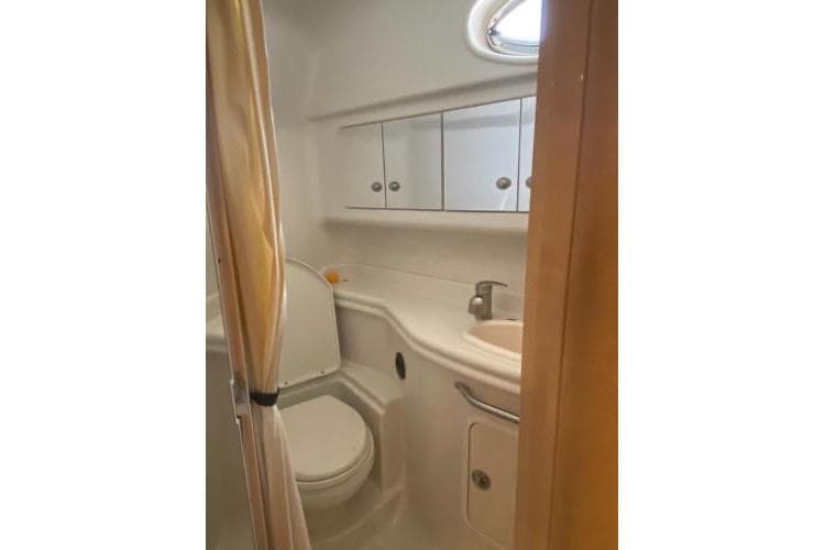 Bathroom interior of 2008 Sea Ray 340 Sundancer yacht, featuring sink and toilet.
