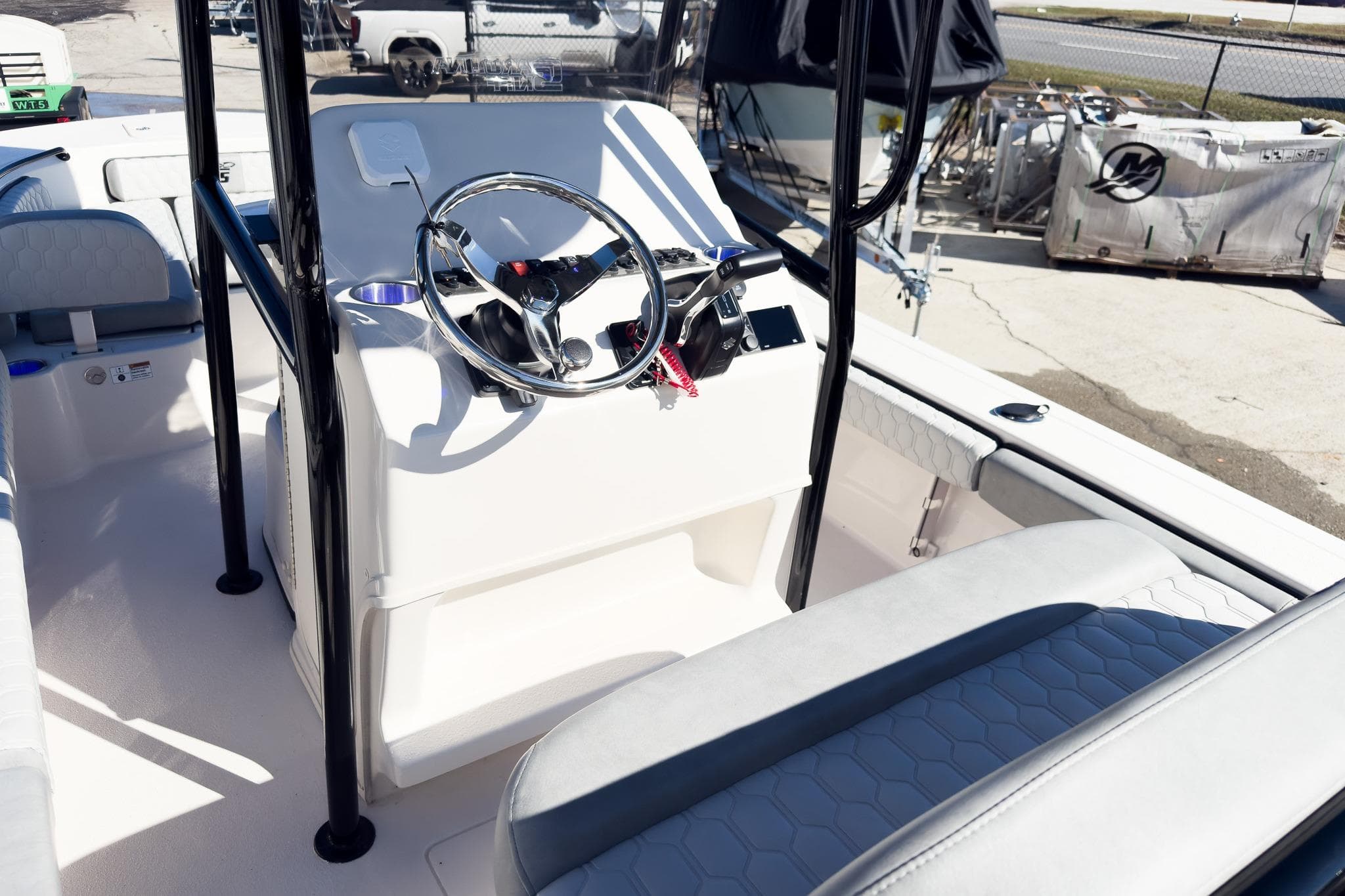 2026 Carolina Skiff 22 Ultra Elite boat interior with steering console and seating.