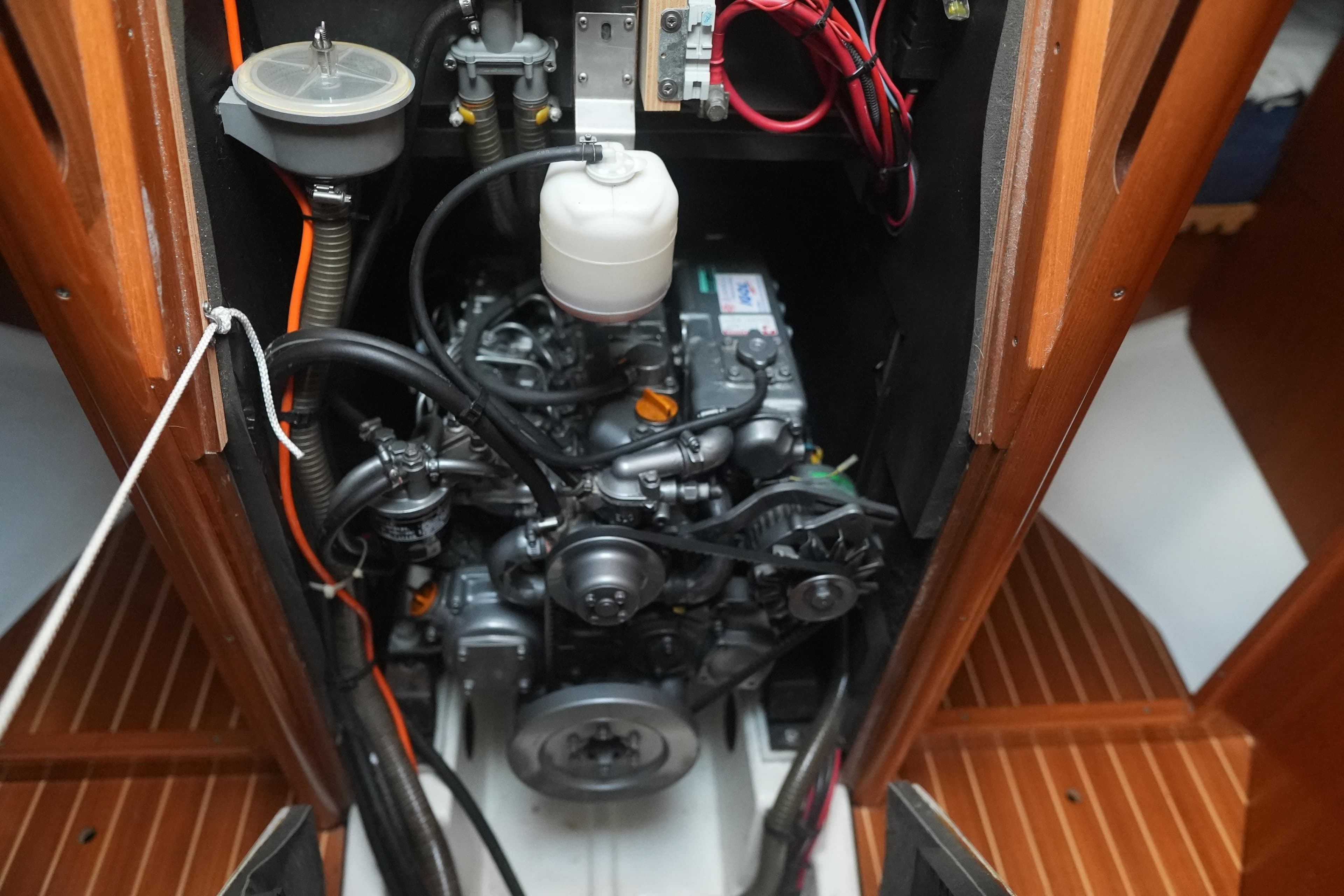 Engine compartment of a 2003 Jeanneau Sun Odyssey 40 sailboat, showcasing mechanical components.