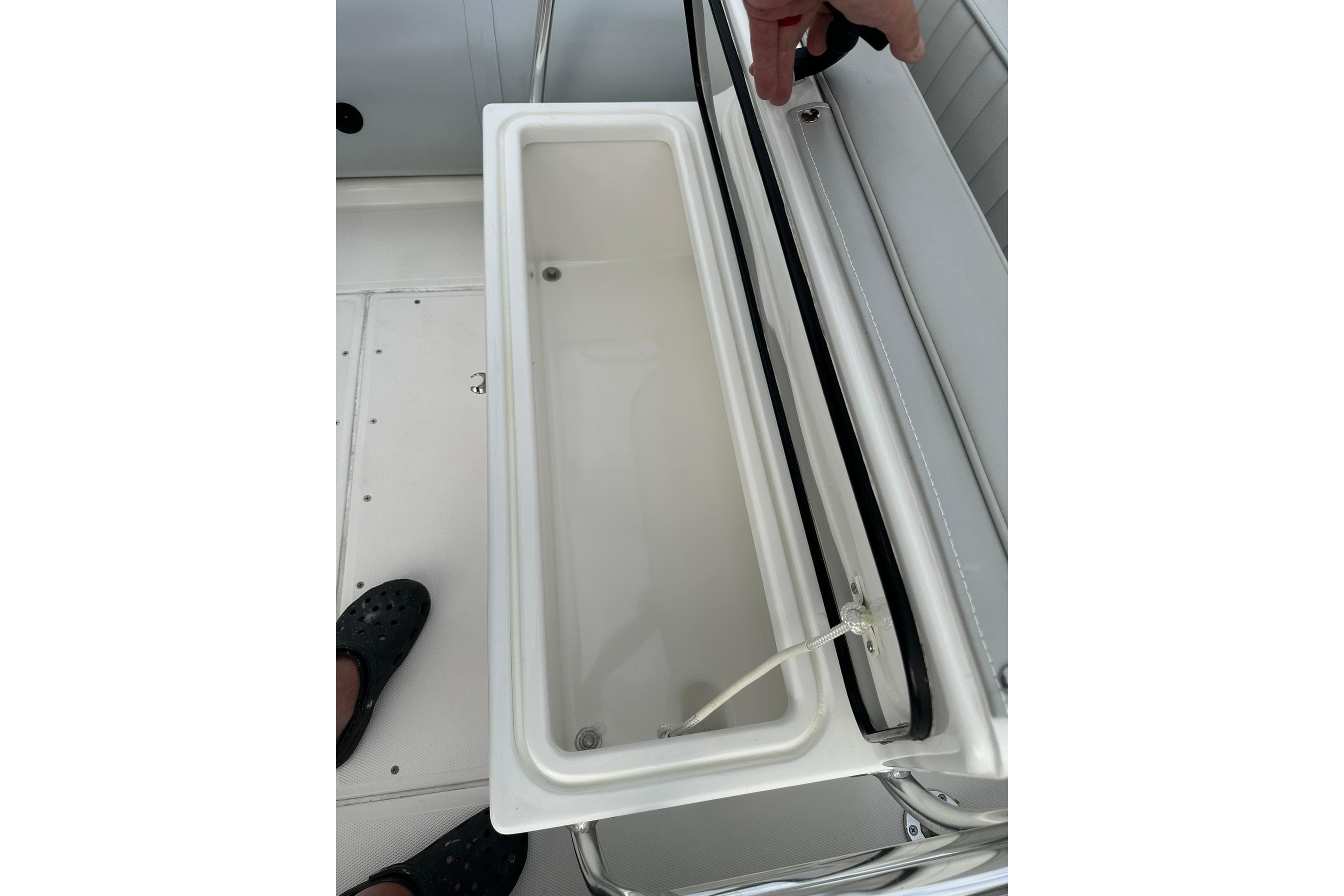 Open storage compartment on 2023 Ribcraft 5.85 boat deck.