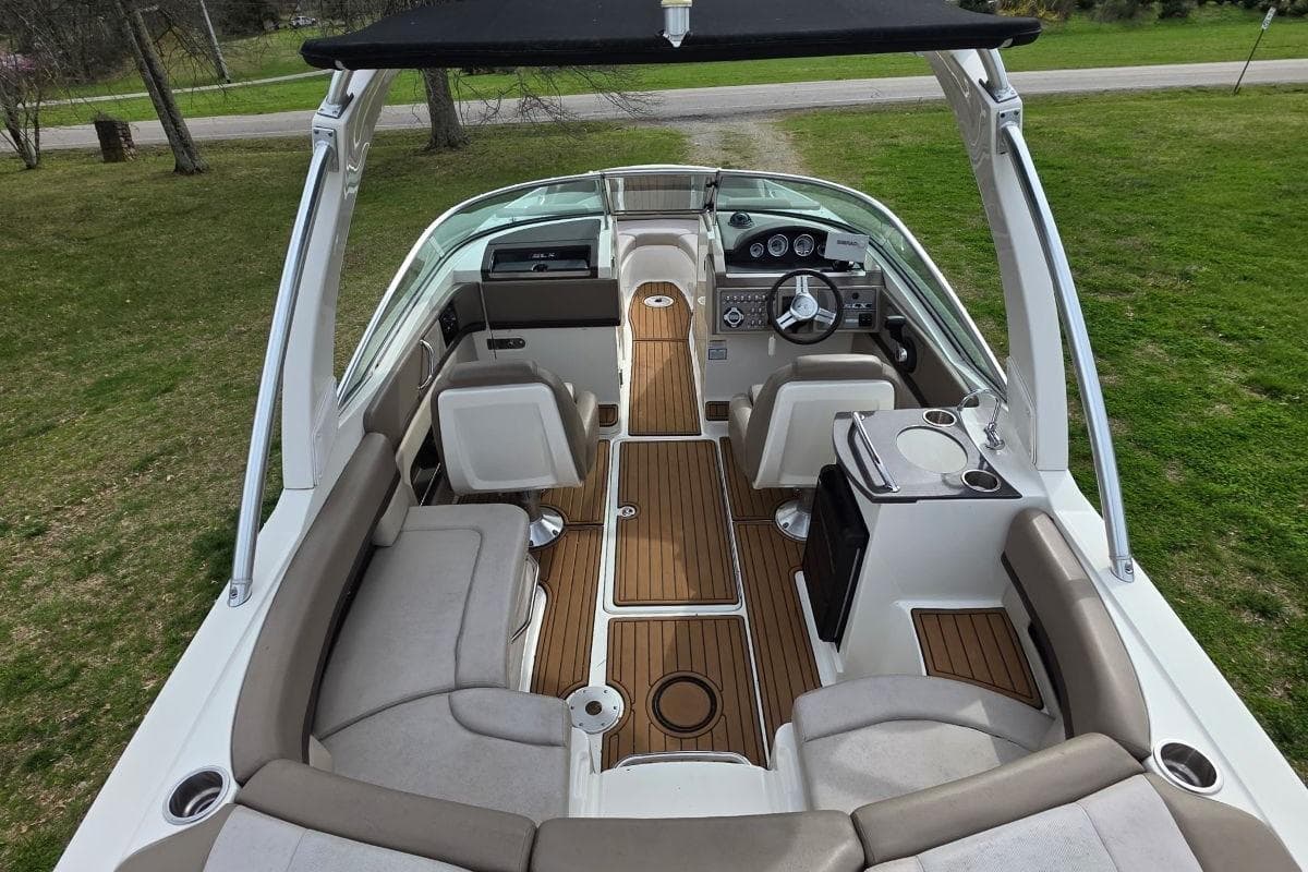 Interior view of 2011 Sea Ray SLX 250 boat with seating and helm.