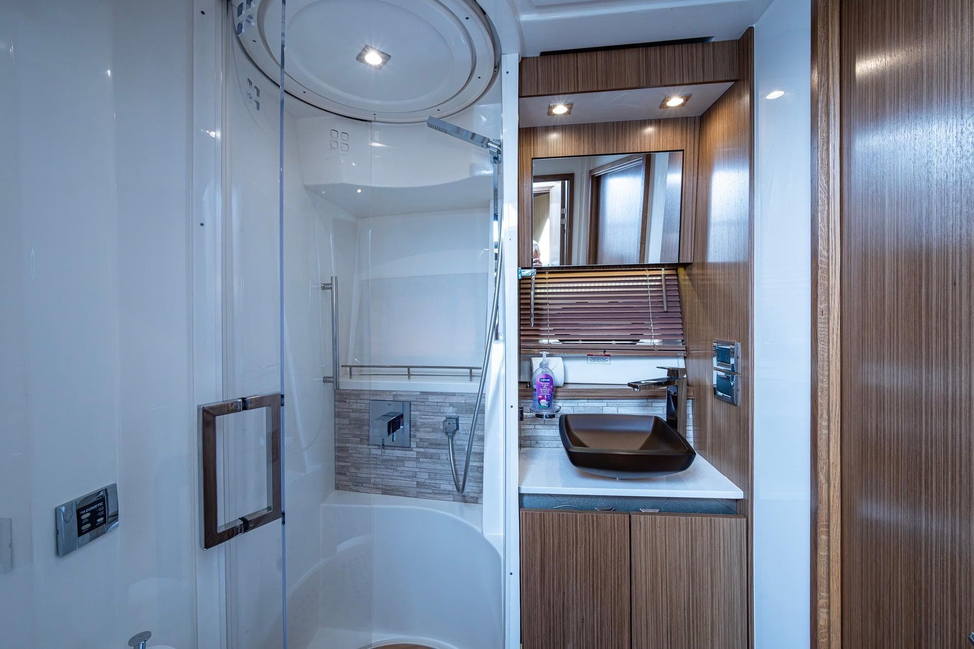 Luxurious bathroom interior of 2018 Sea Ray L550 Fly yacht with modern fixtures.