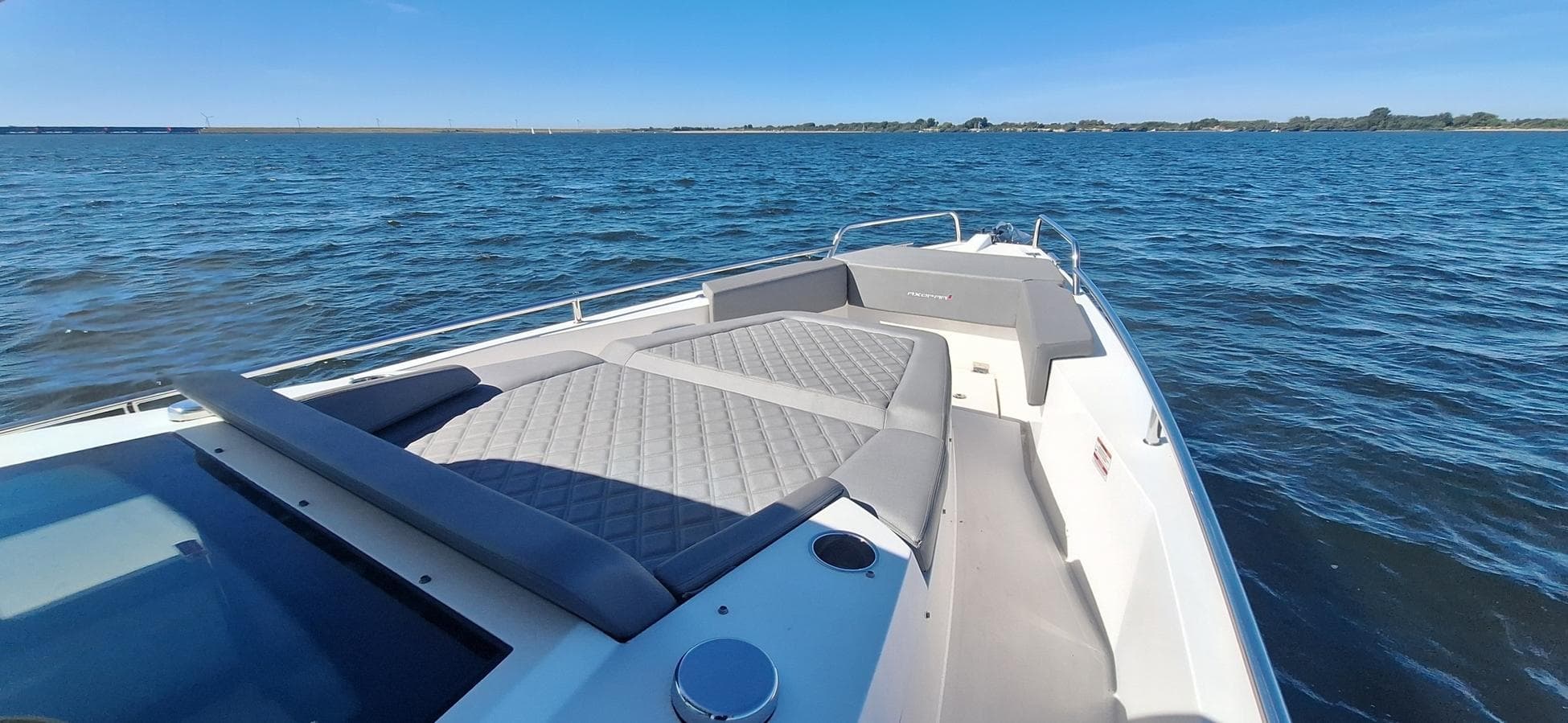 2019 Axopar 37 boat with spacious deck and seating on open water.