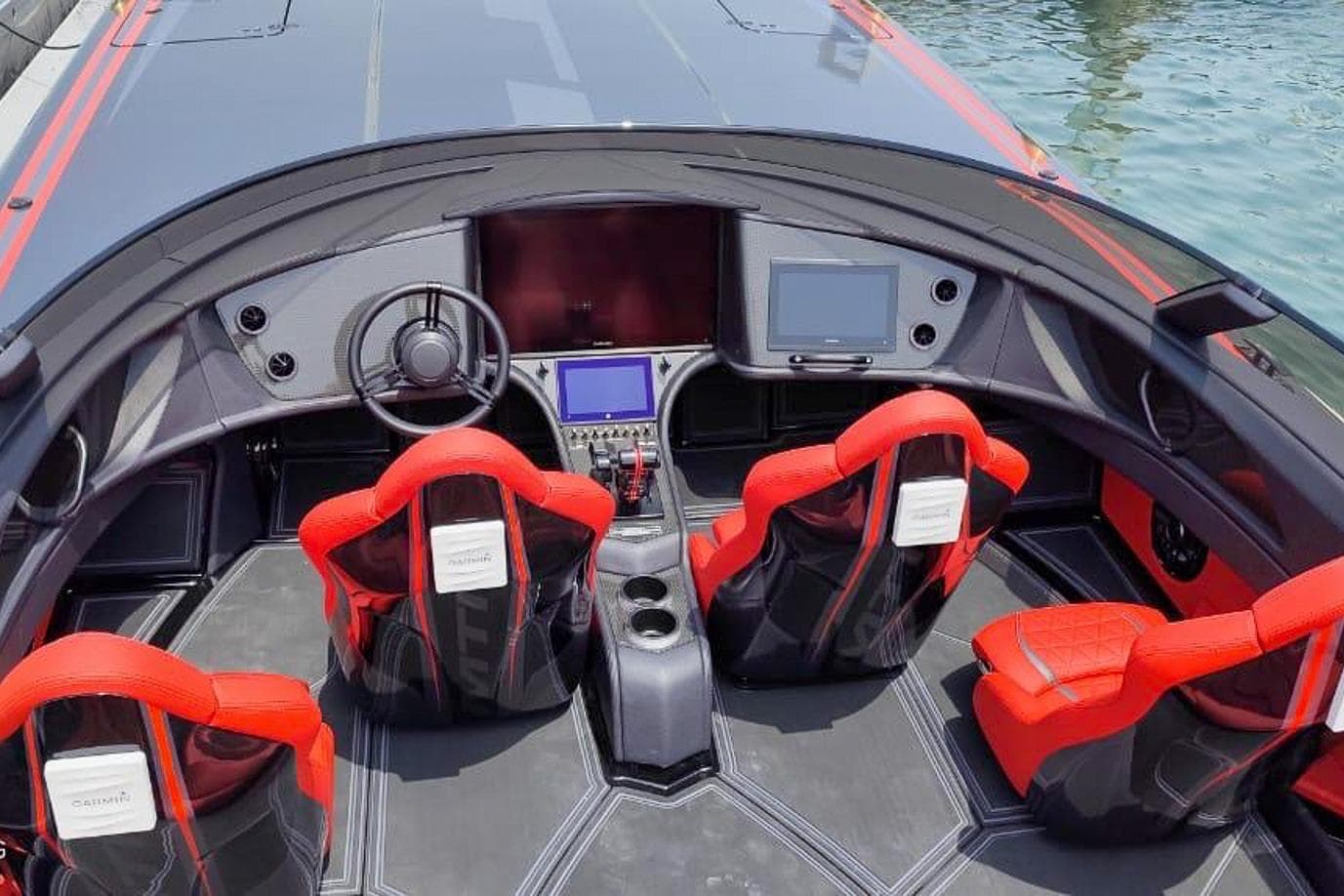 2025 MTI 440X boat interior with red seats and advanced navigation systems.