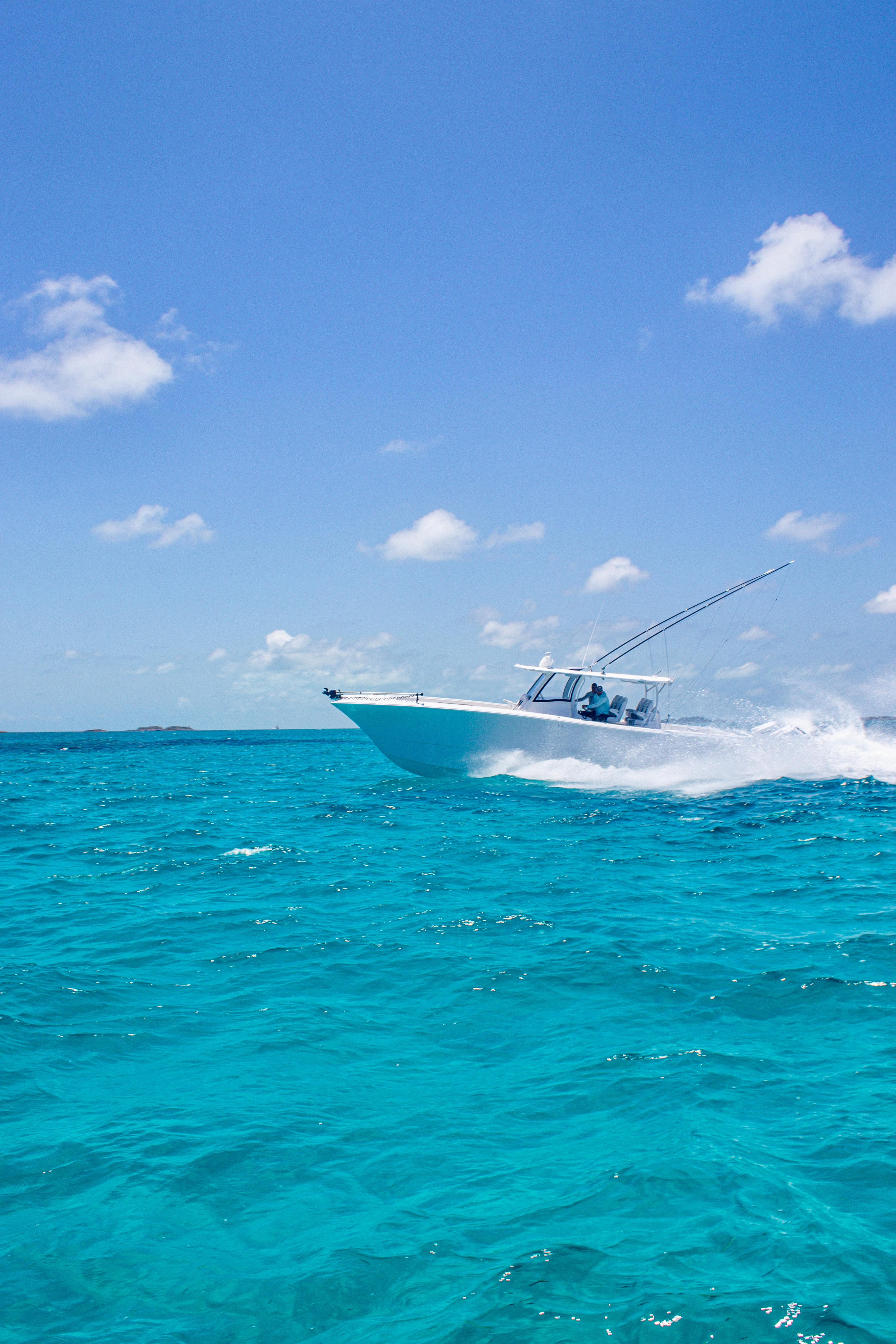 Front Runner 43 Catamaran cruising on clear blue ocean under sunny sky, 2026 model.