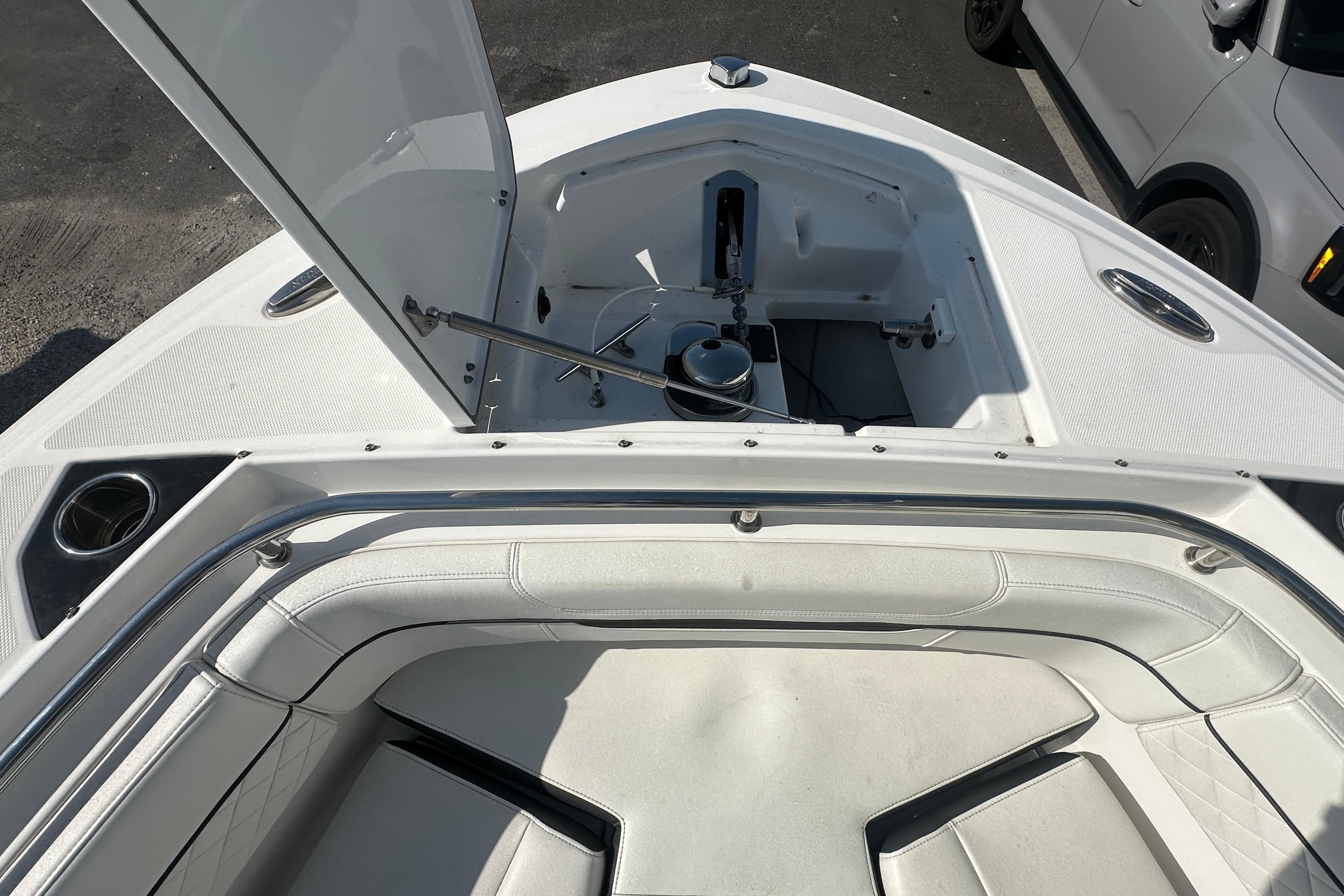 2021 Blackfin 252 DC boat interior with open storage compartment and seating area.
