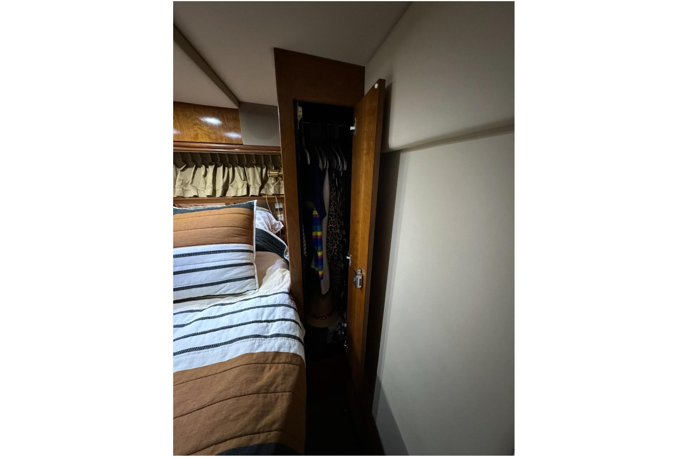 Interior of 2003 Cruisers Yachts 4370 Express with bed and closet.