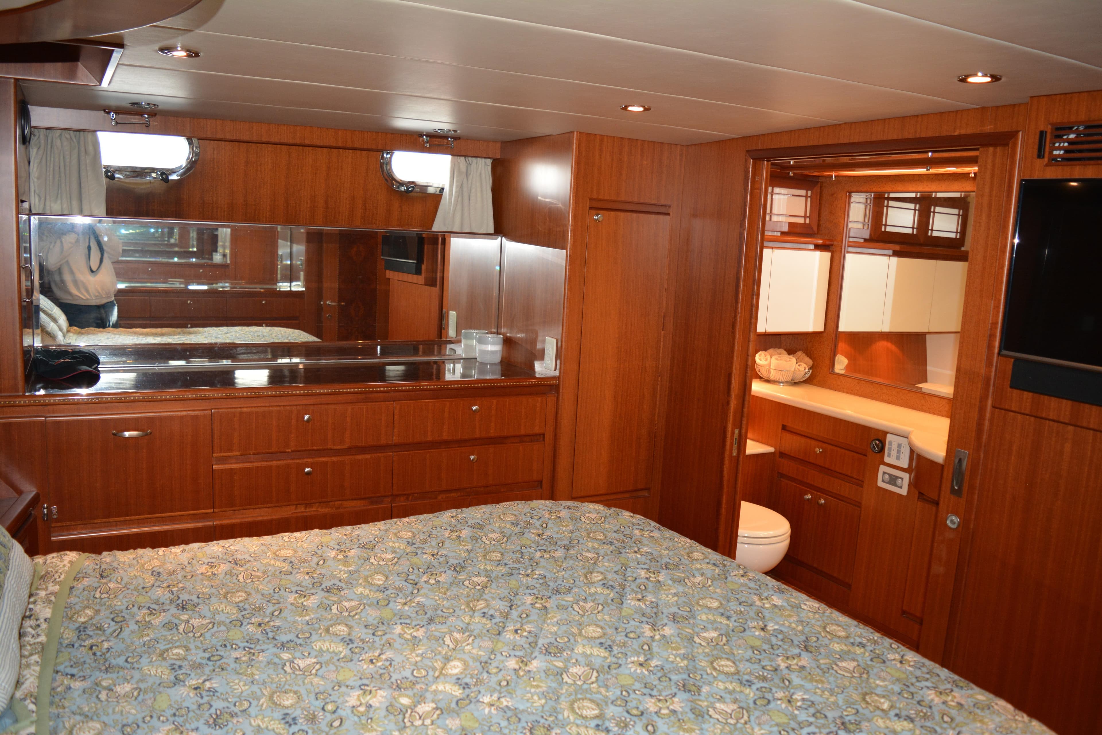 Luxurious 2008 Novatec Islander 60 yacht bedroom with wood paneling and ensuite bathroom.
