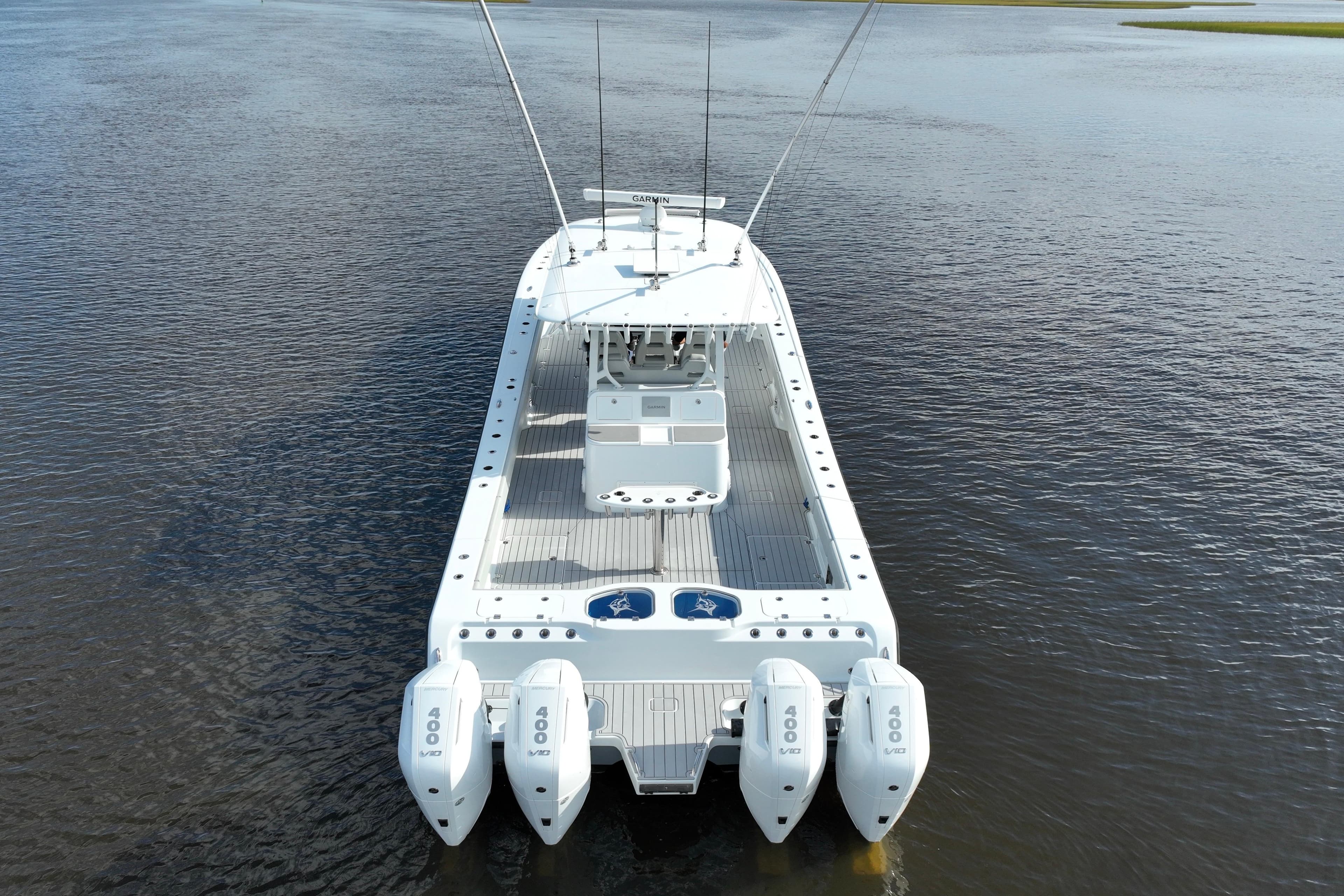 Freeman 47 boat, 2022 model, with quad engines on calm water.