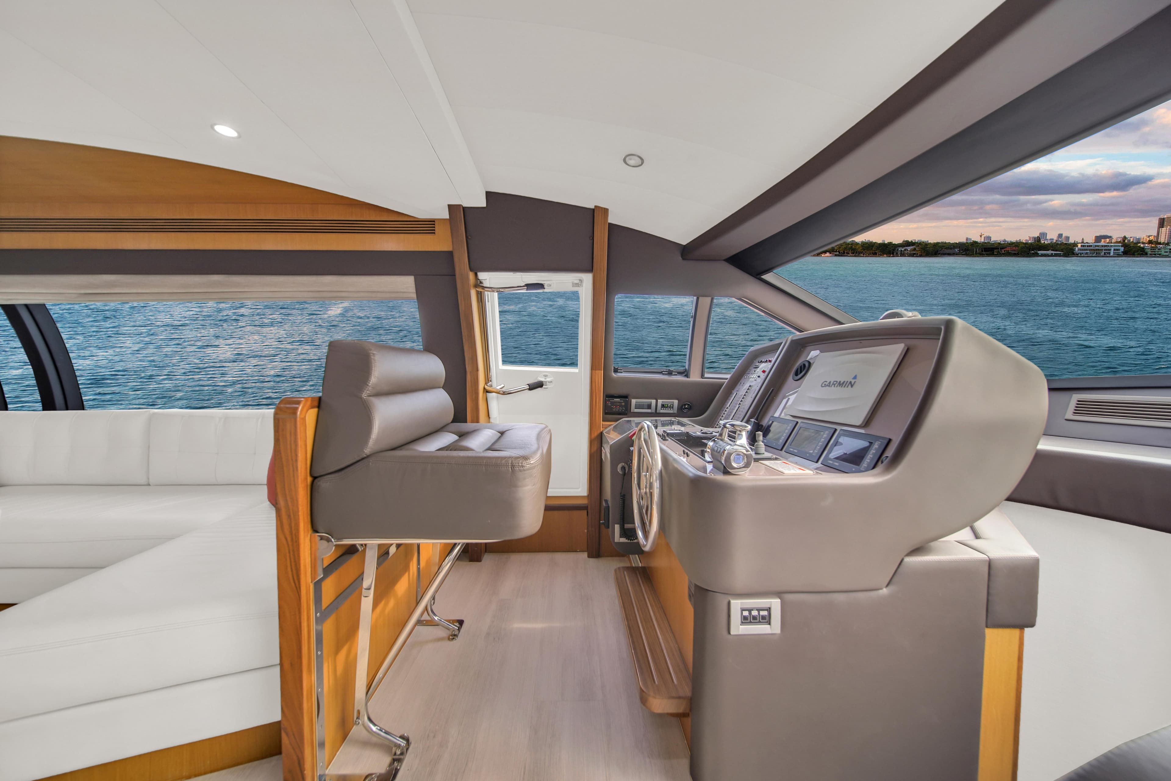 Interior of 2011 Ferretti Yachts 660, featuring modern helm and luxurious seating.