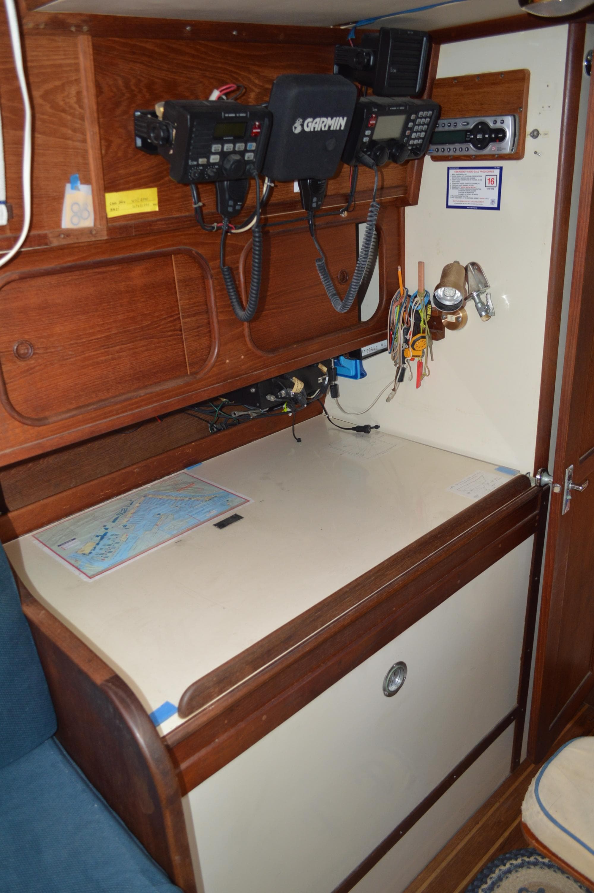 Navigation station on 1984 Irwin 38 sailboat with electronics and chart.