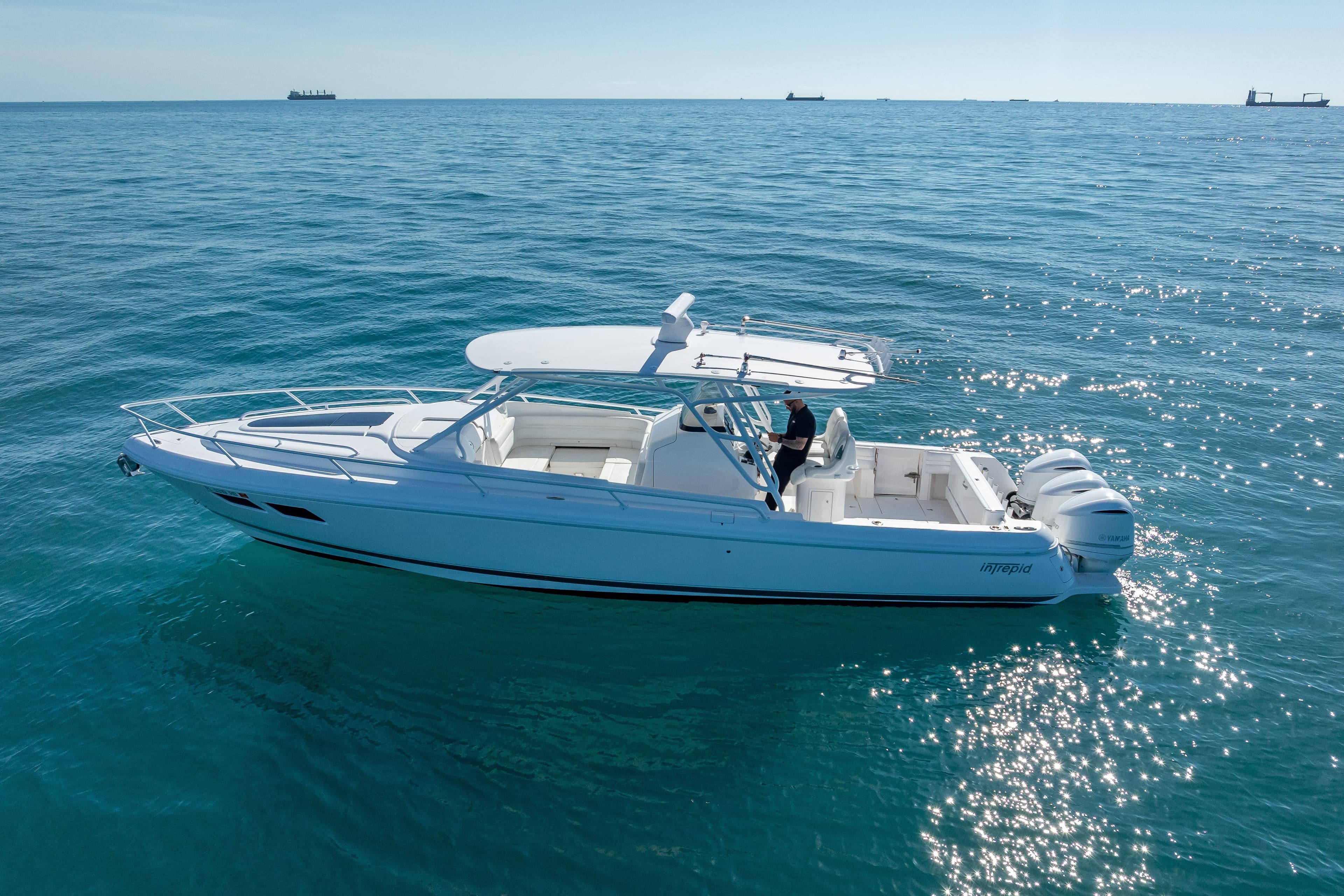 2016 Intrepid 375 Center Console boat cruising on open blue water.